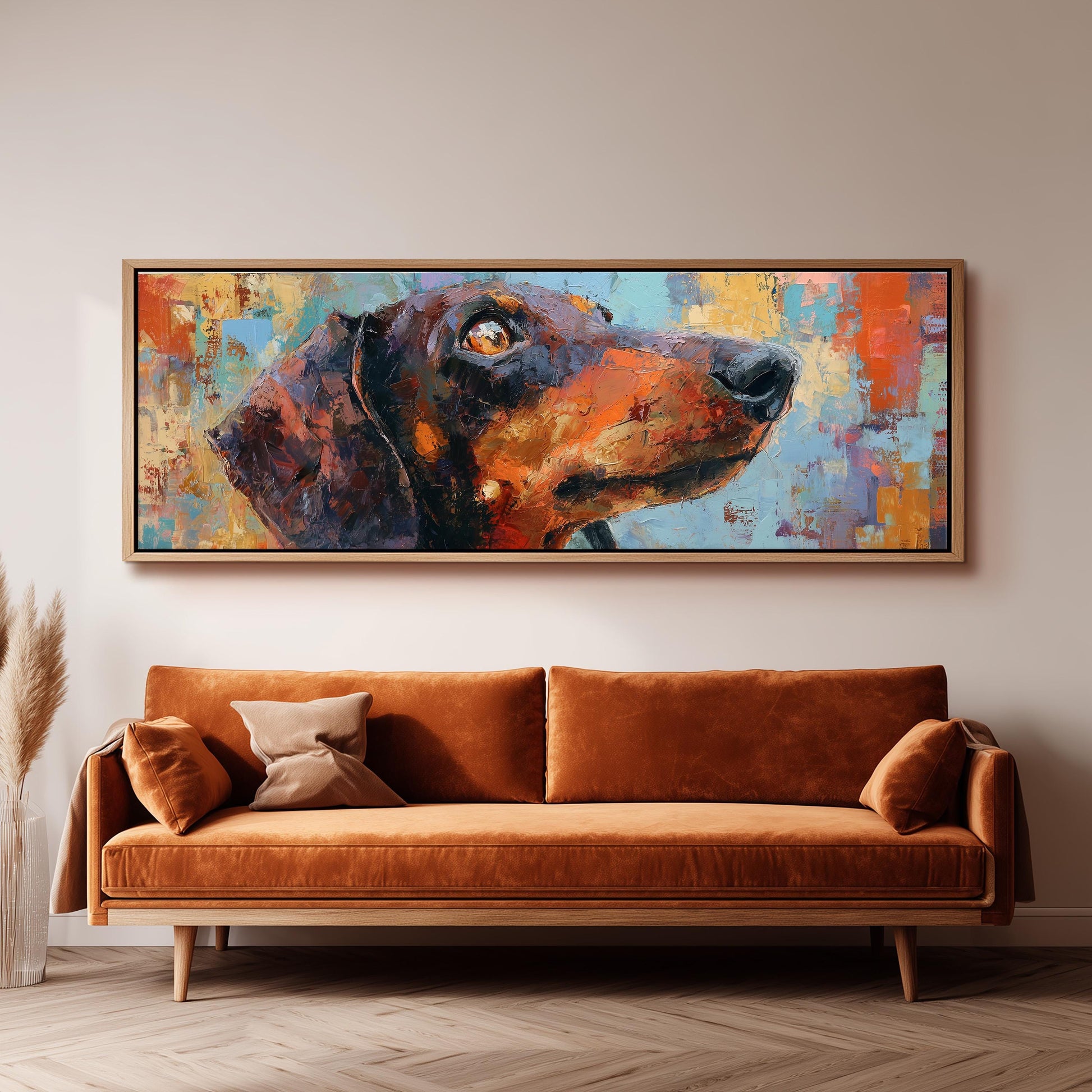 a large, colorful painting of a dog's head hanging on a wall above a brown sofa.