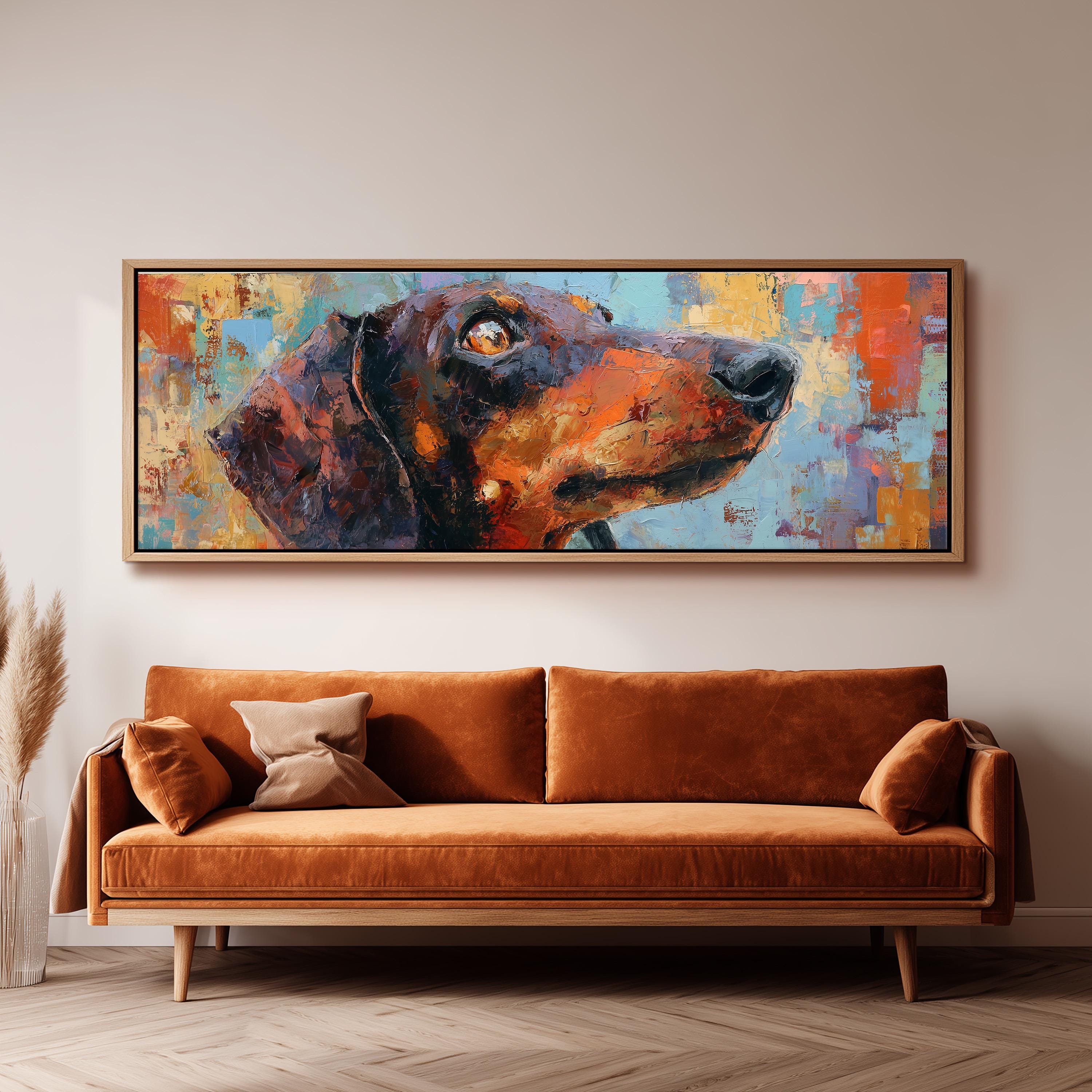 a large, colorful painting of a dog's head hanging on a wall above a brown sofa.