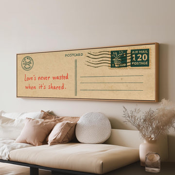 Vintage postcard with a love quote long horizontal canvas print above a sofa in a living room