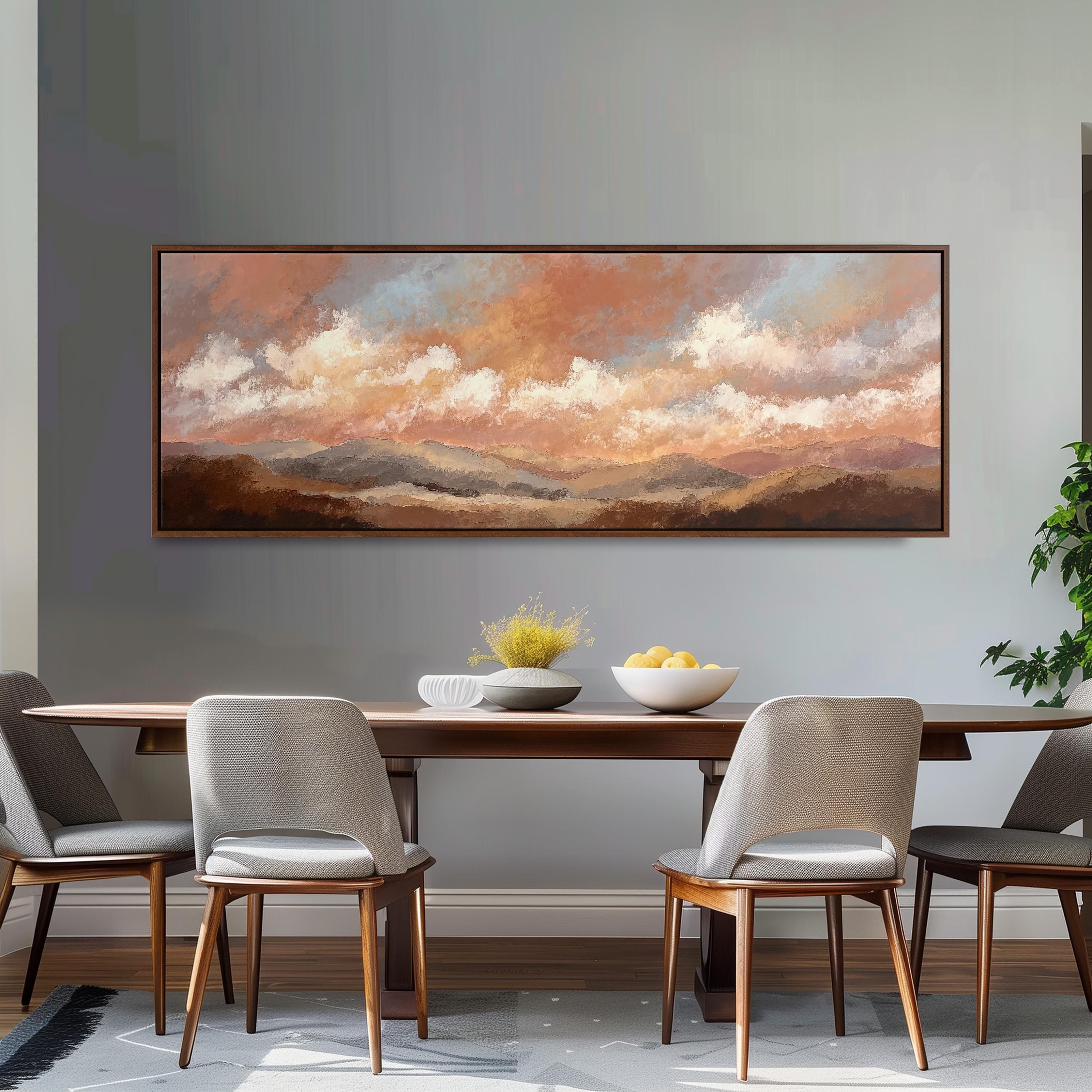 a dining room with a large painting of a landscape hanging on the wall above a wooden dining table with four chairs. The painting depicts a serene sky with clouds and mountains, creating a peaceful and inviting atmosphere.