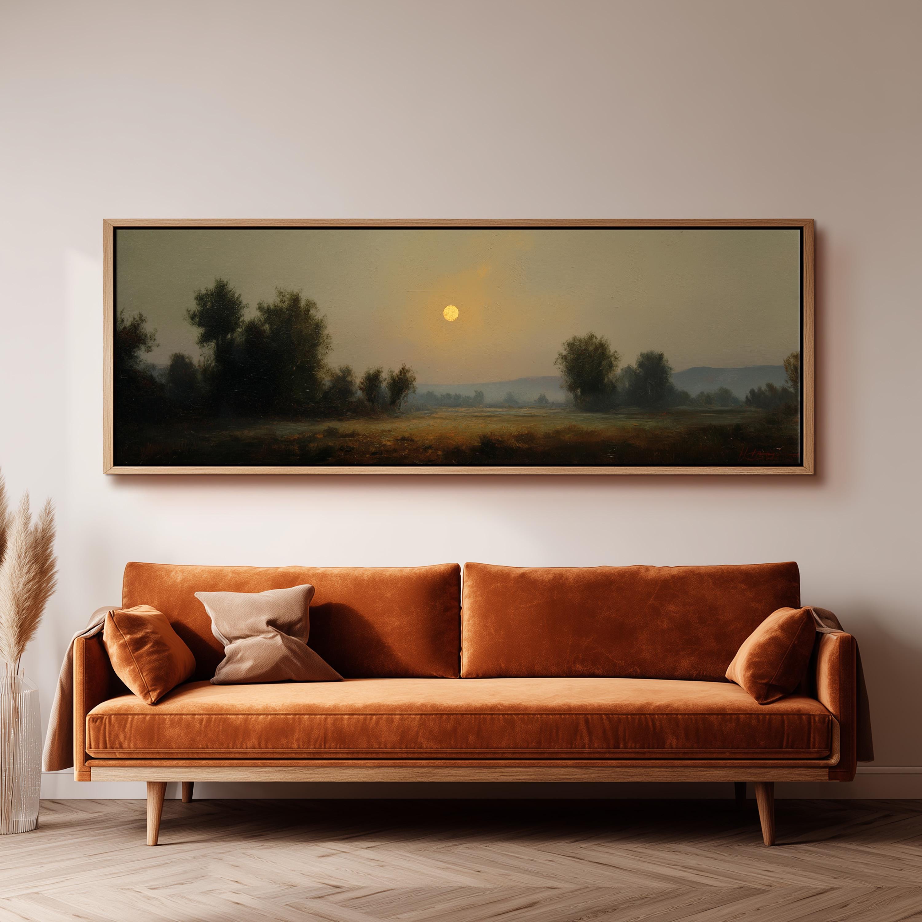 a large, rectangular painting hanging on a wall above a brown sofa.