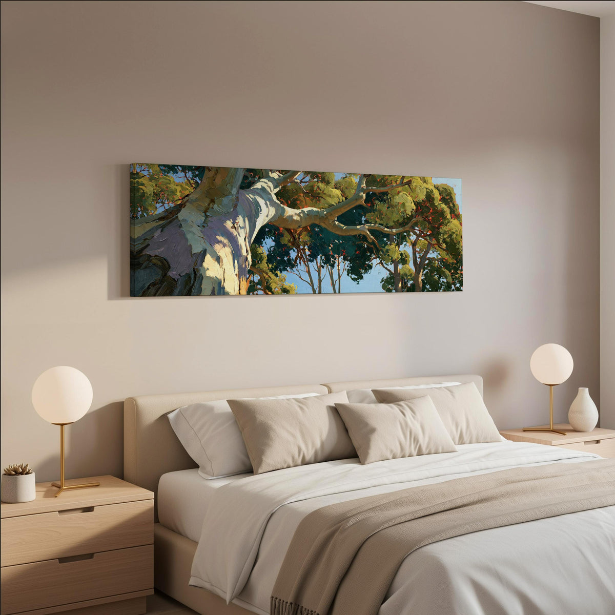 Sunlit eucalyptus trunk and branches wide panoramic canvas print above a bed in a neutral bedroom