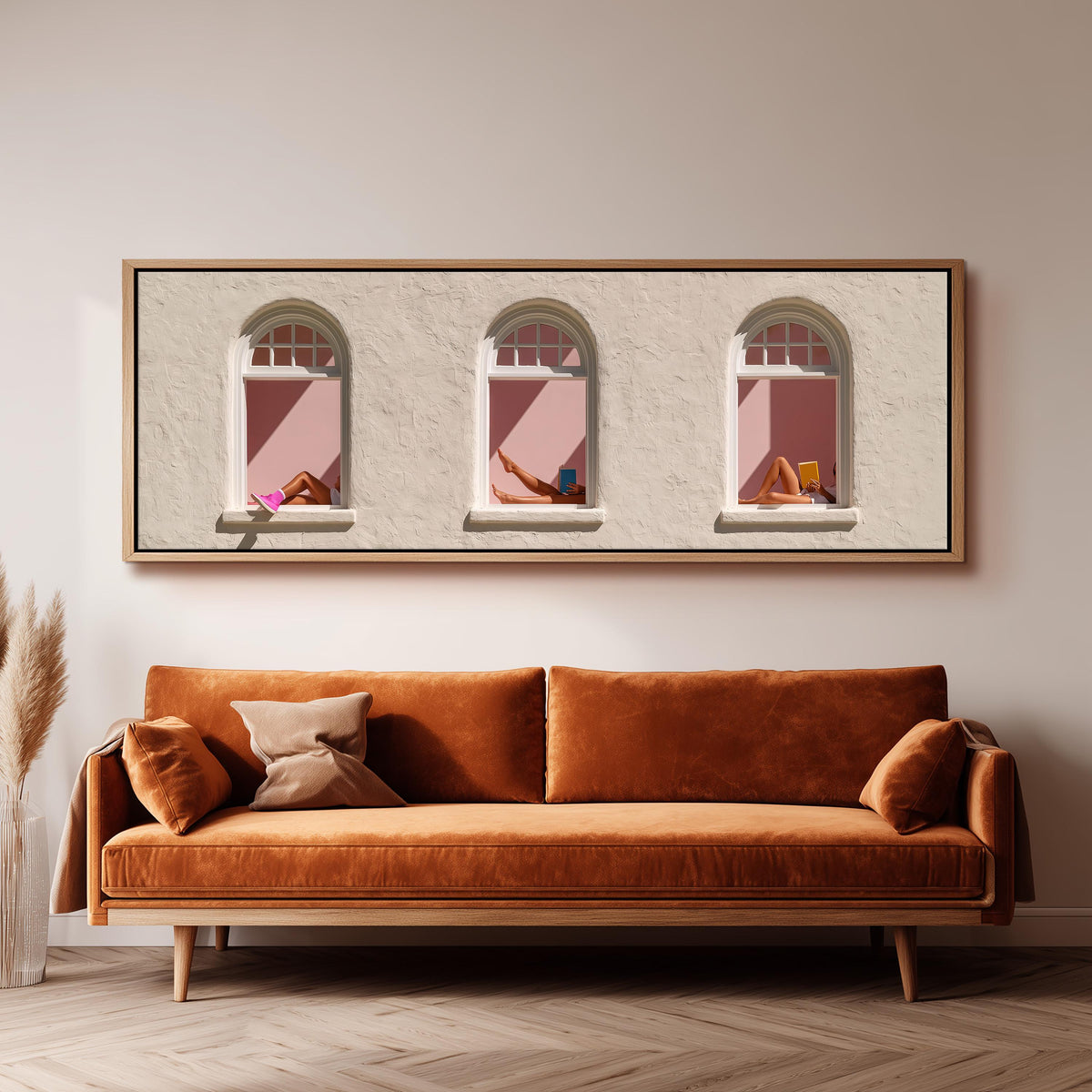 Women reading in three arched windows panoramic canvas print above a sofa in a living room