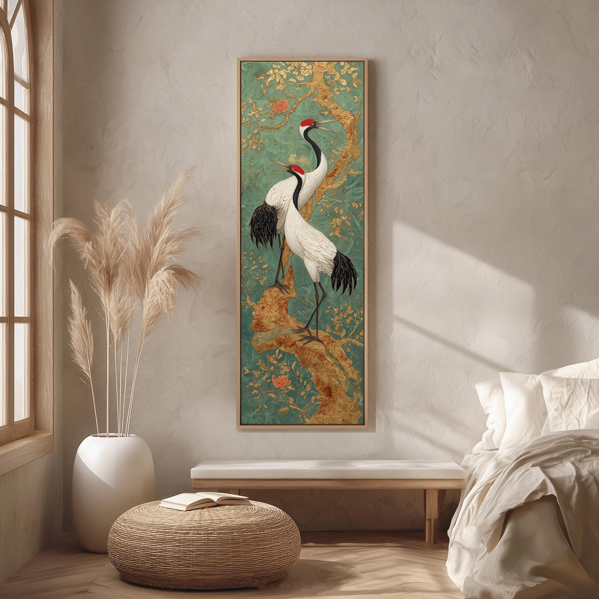 a large painting of two cranes standing on a branch, hanging on a wall in a room with a wooden floor and a white bed.