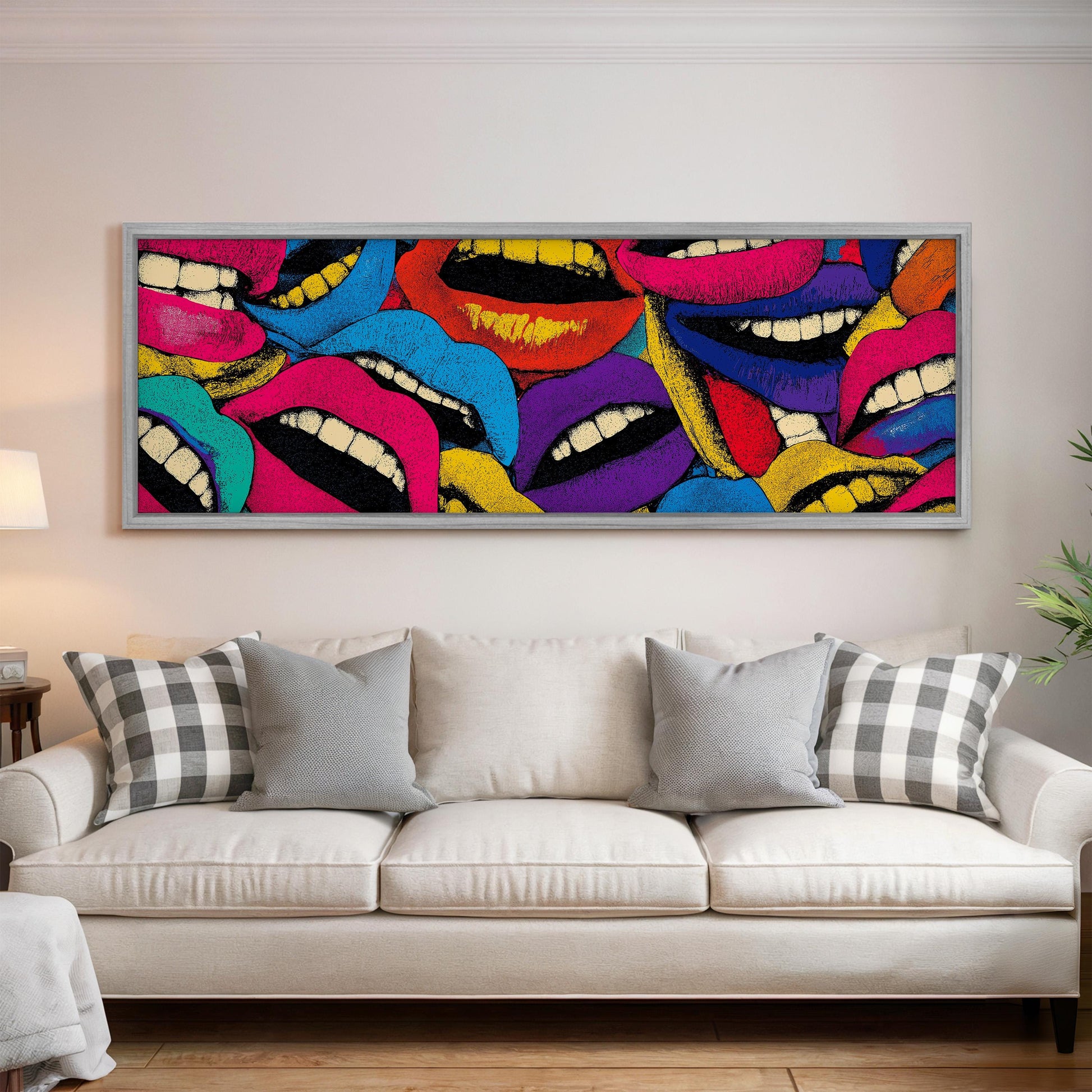 a large, colorful painting of multiple lips on a wall above a white couch in a living room setting.
