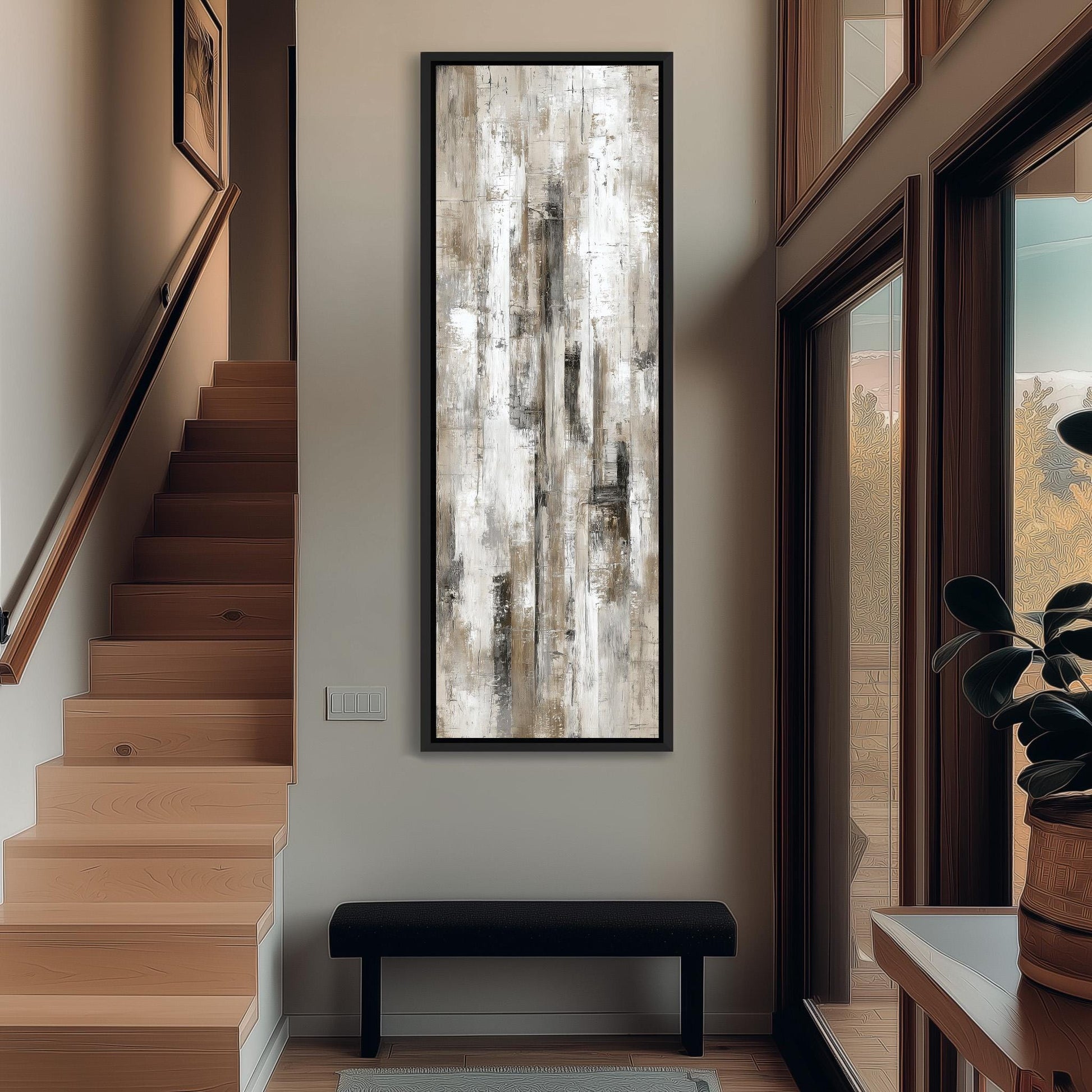 a modern and minimalist interior design with a large abstract painting hanging on the wall above a black bench. The room has wooden stairs leading up to a door, and a window with a view of trees can be seen.