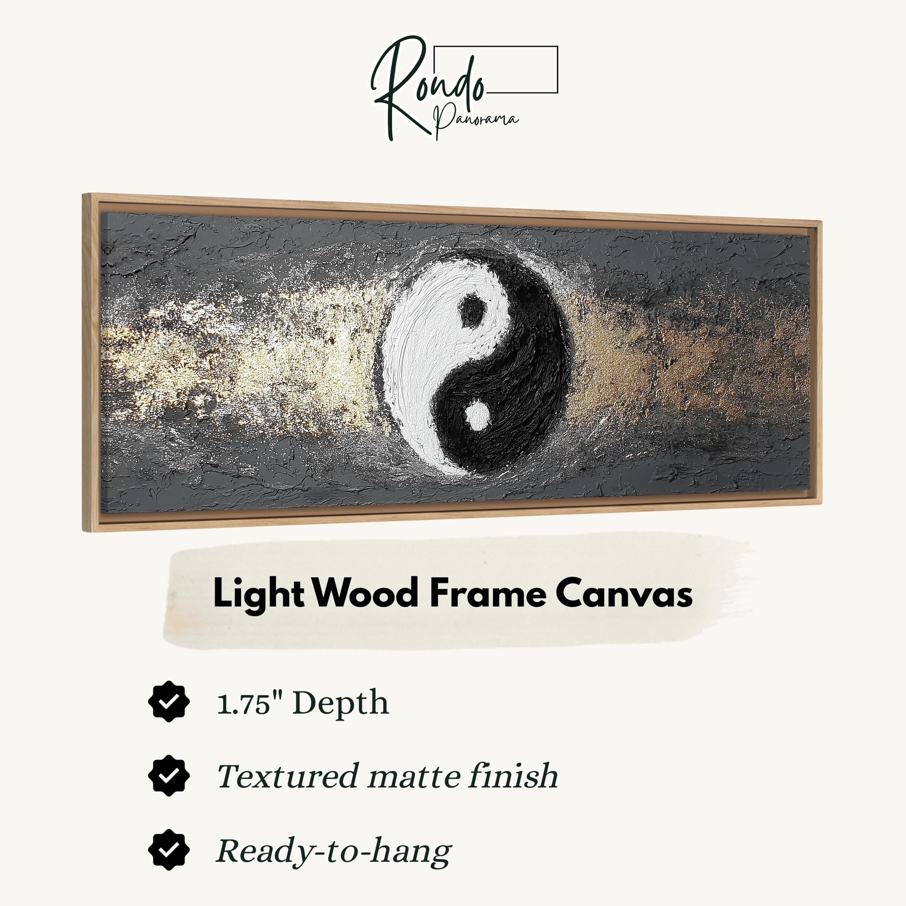The image is a framed artwork depicting a yin and yang symbol, with a light wood frame.