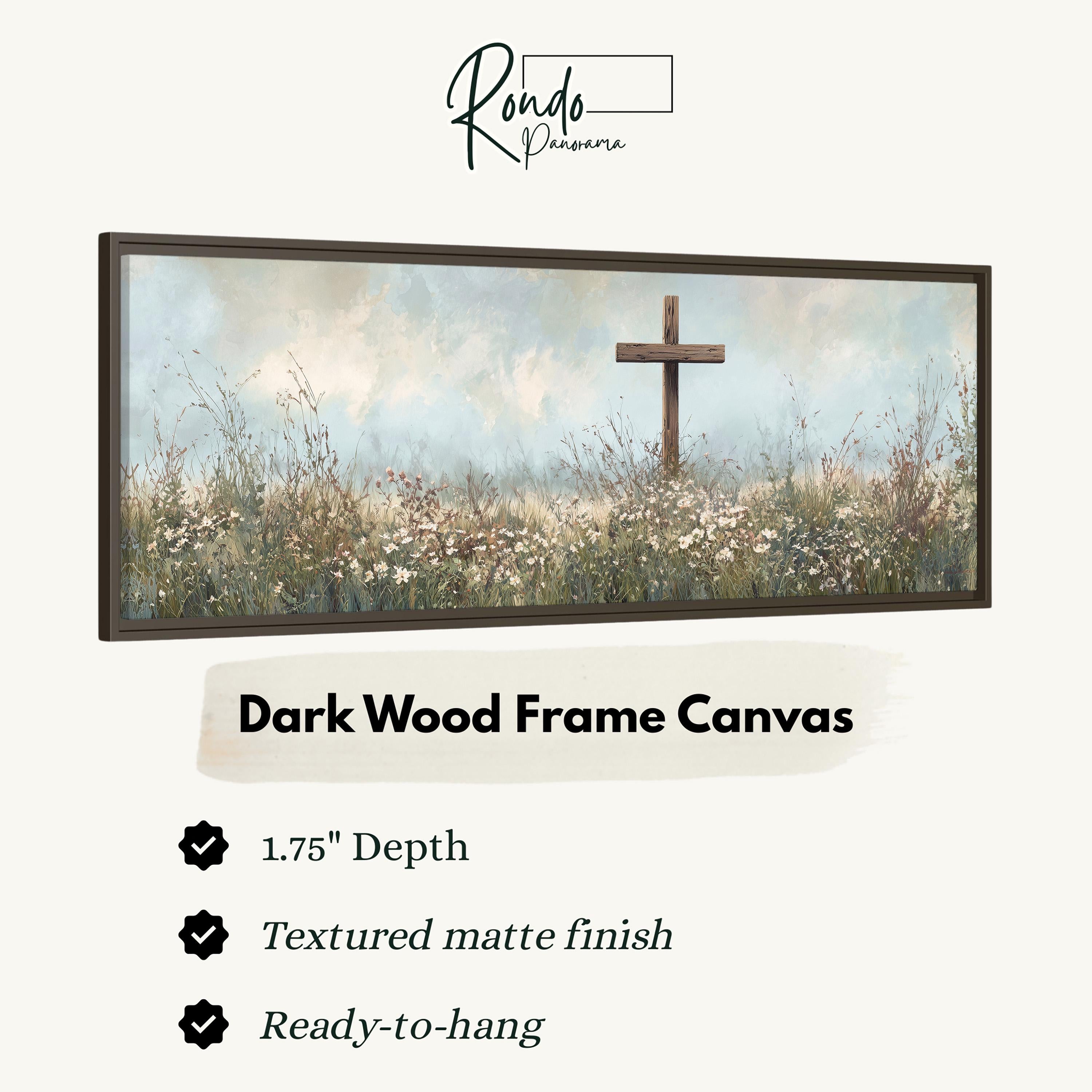 The image is a dark wood frame canvas depicting a cross in a field of flowers.