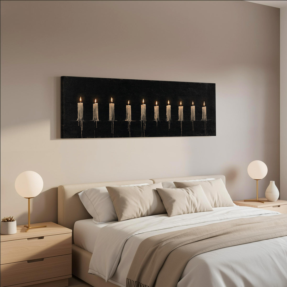 Ten lit candles on black wide panoramic canvas print above a bed in a neutral bedroom