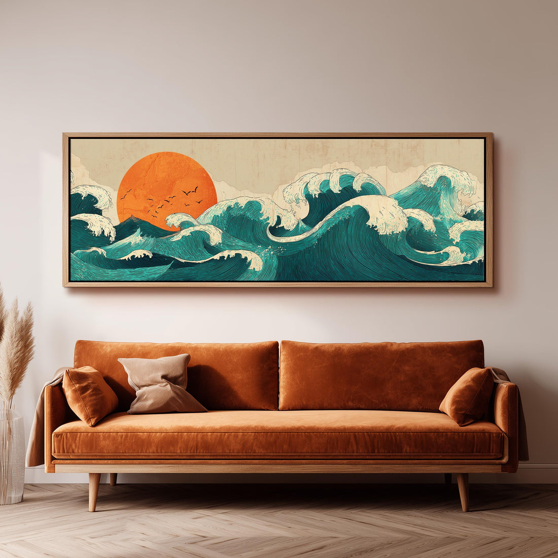 a large, framed artwork depicting a seascape with a sun and waves, hanging on a wall above a brown sofa.