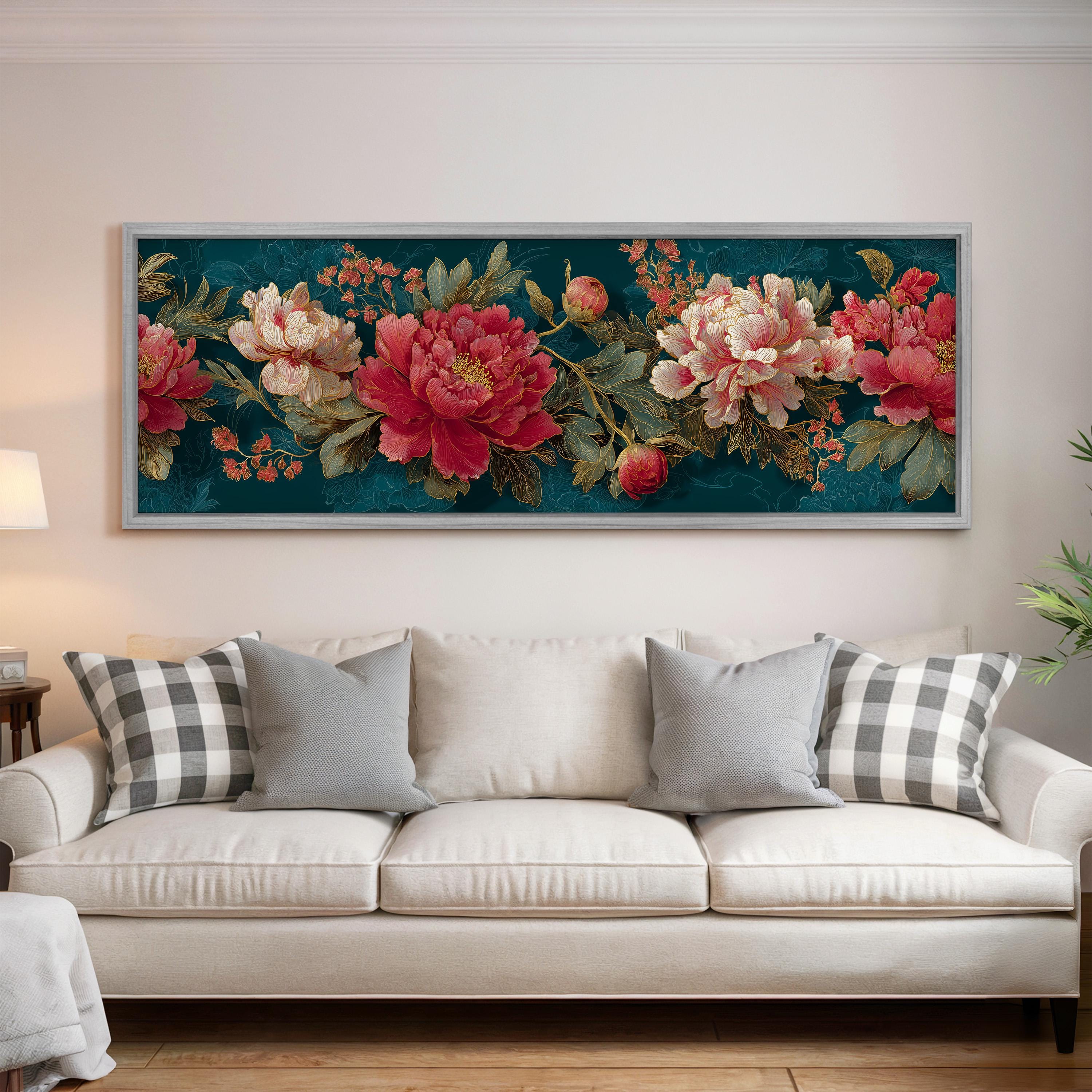 a large floral print hanging on a wall above a white sofa with gray and white plaid throw pillows.