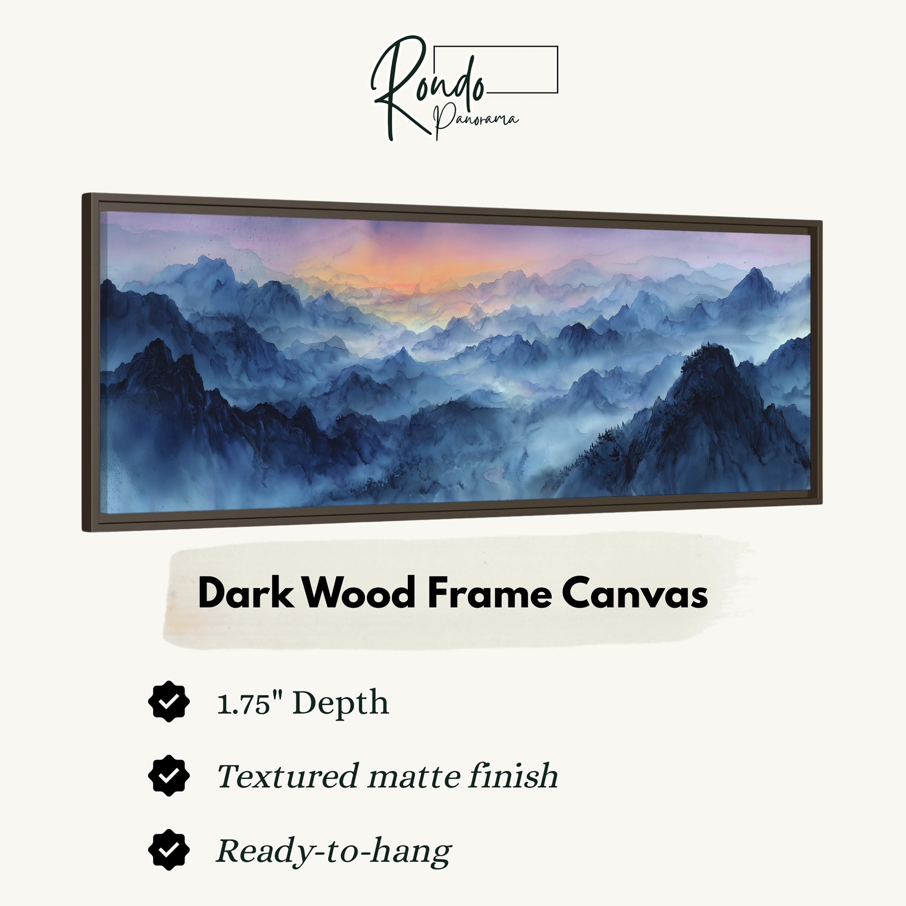 The image is a framed canvas depicting a mountainous landscape with a hazy, misty atmosphere.