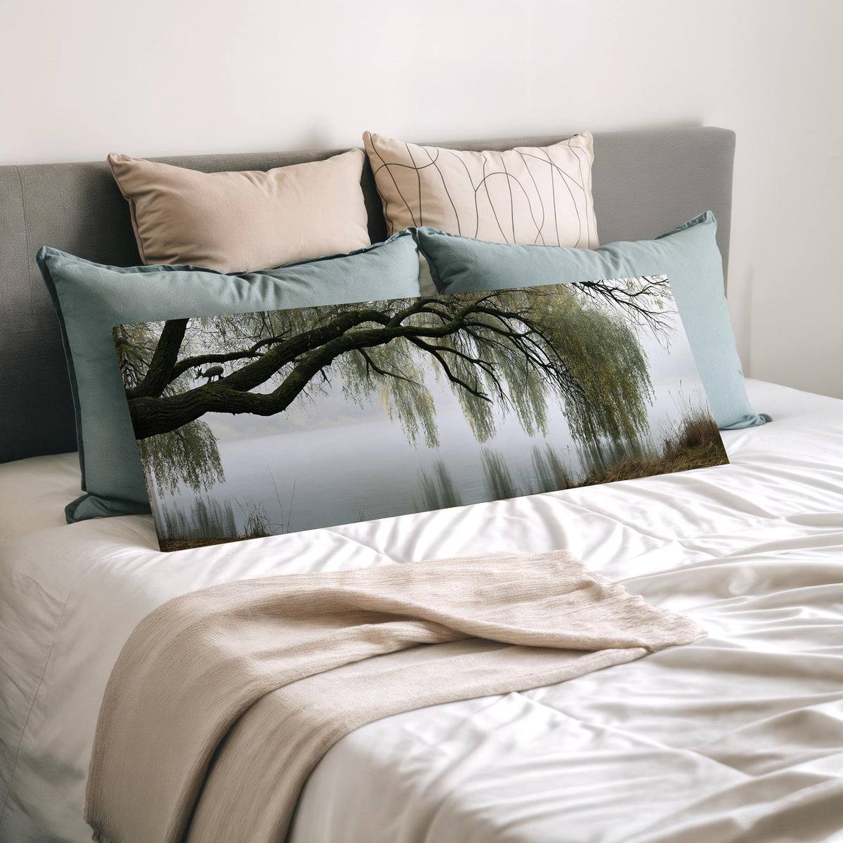 Weeping willow over a misty lake wide panoramic canvas print laid on a bed to show its size