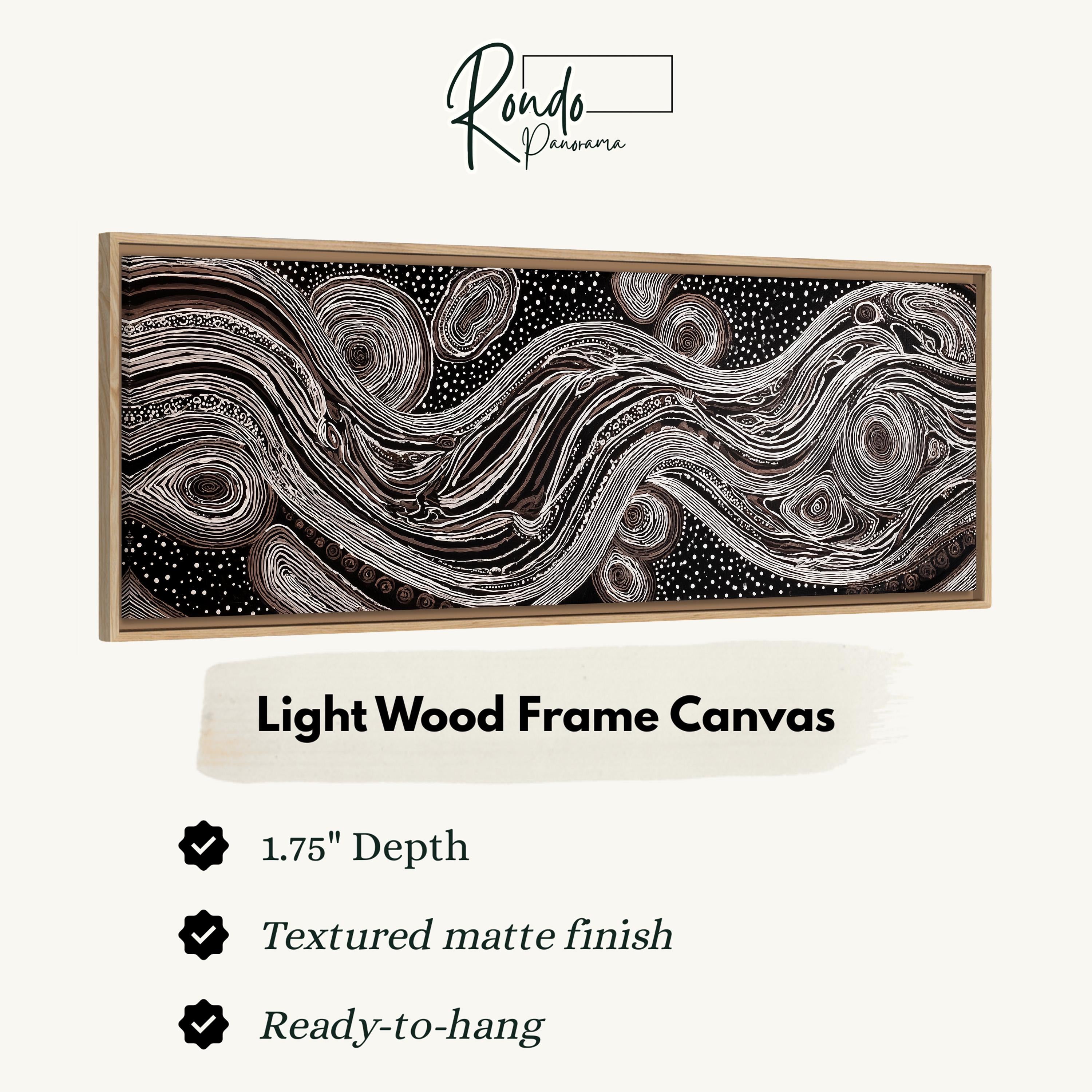 a large, abstract artwork with a light wood frame. The artwork has a 1.75" depth and is textured with a matte finish. It is ready to hang and is described as a Light Wood Frame Canvas.