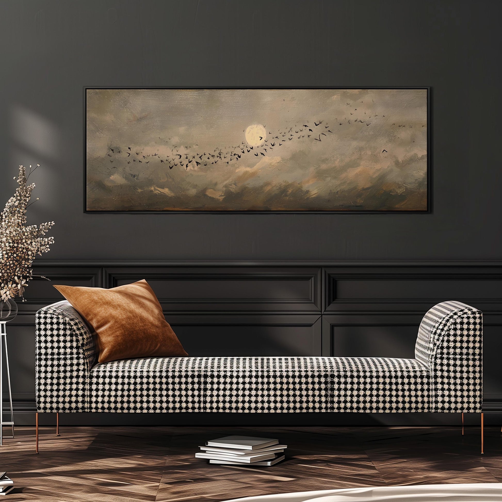 a black and white checkered sofa with a brown throw pillow, set against a dark wall with a large painting of a flock of birds in the sky above it.