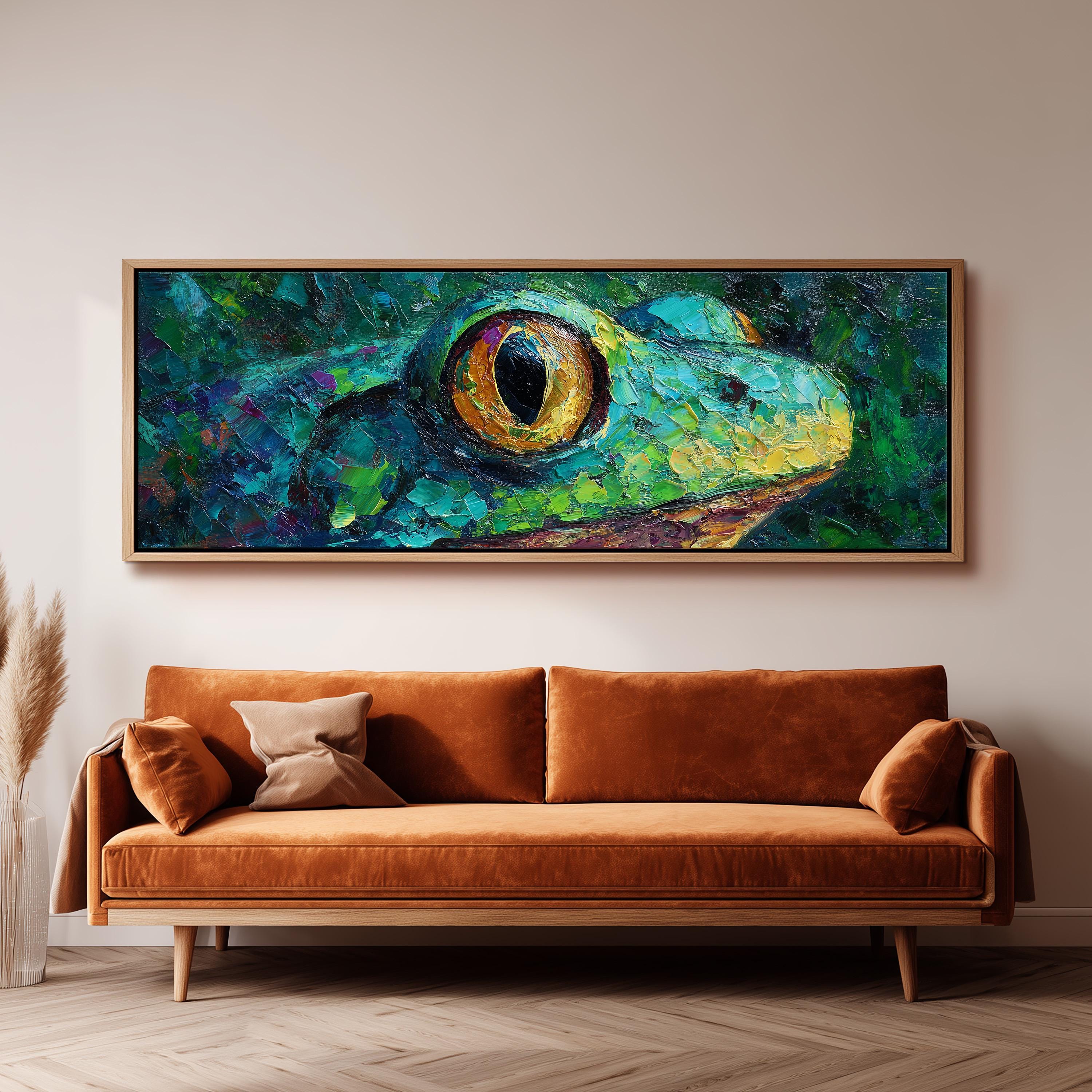 a large, vibrant painting of a frog's eye hanging on a wall above a brown sofa.