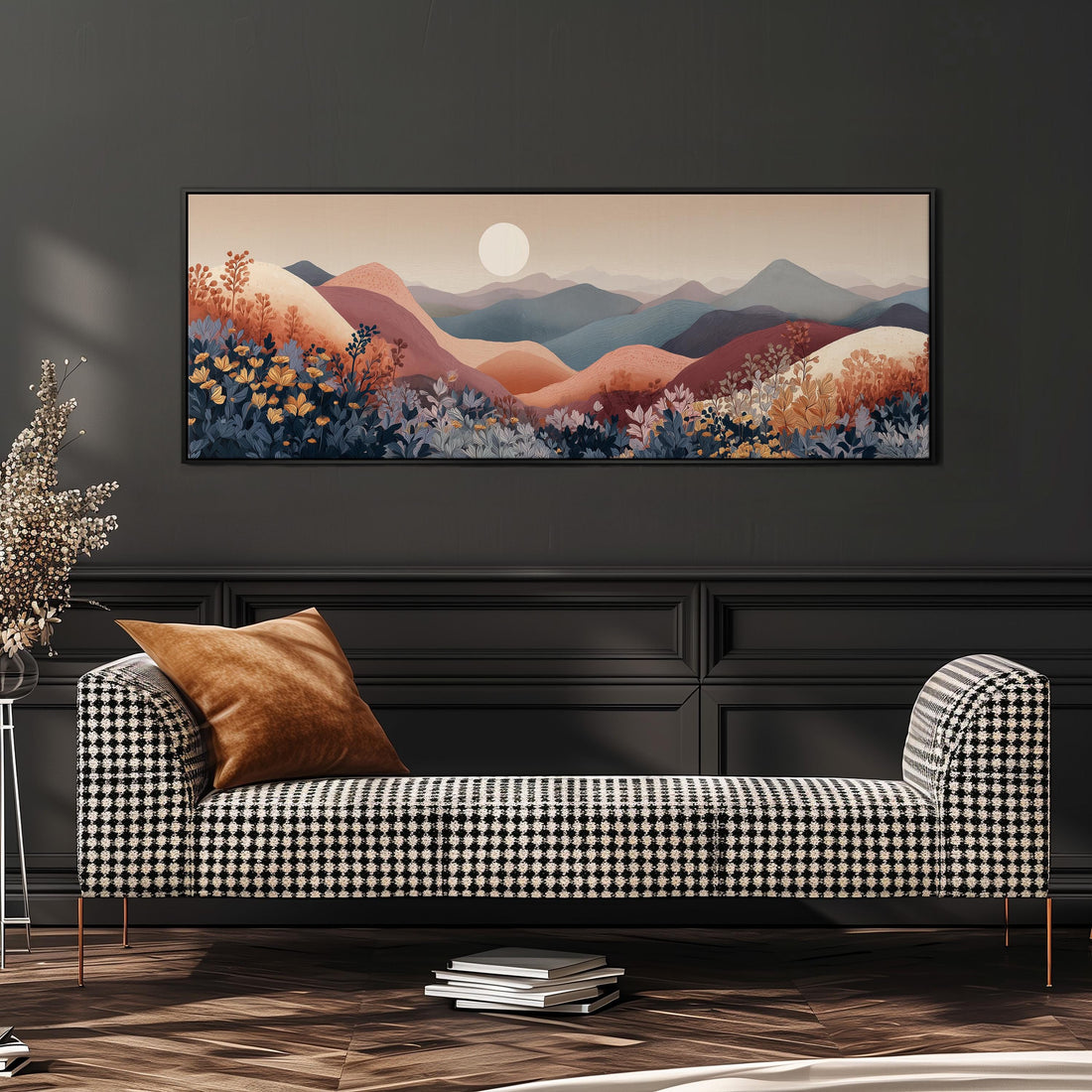 a large, colorful landscape painting hanging on a wall above a bed with white pillows and a gray blanket.
