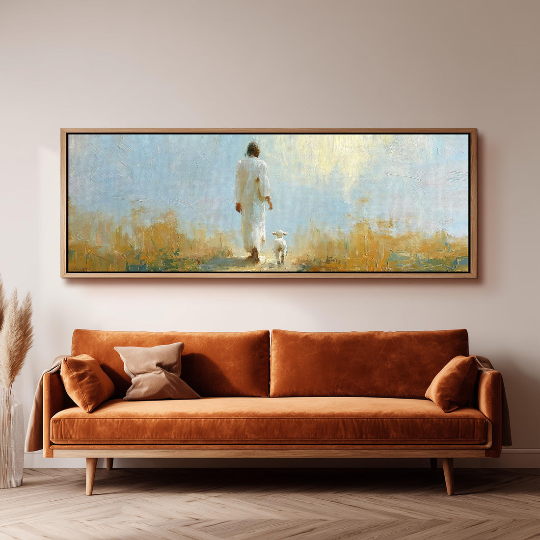 Jesus the shepherd walking with a lamb long horizontal canvas print above a sofa in a living room