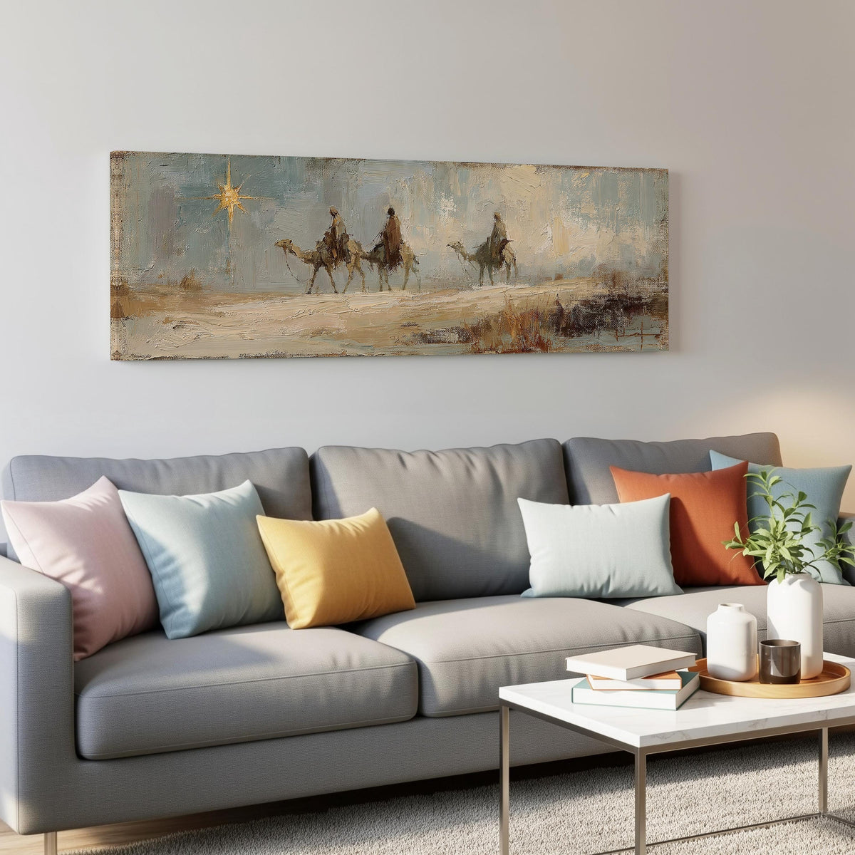 Wise men on camels following the star panoramic canvas print above a grey sofa in a living room