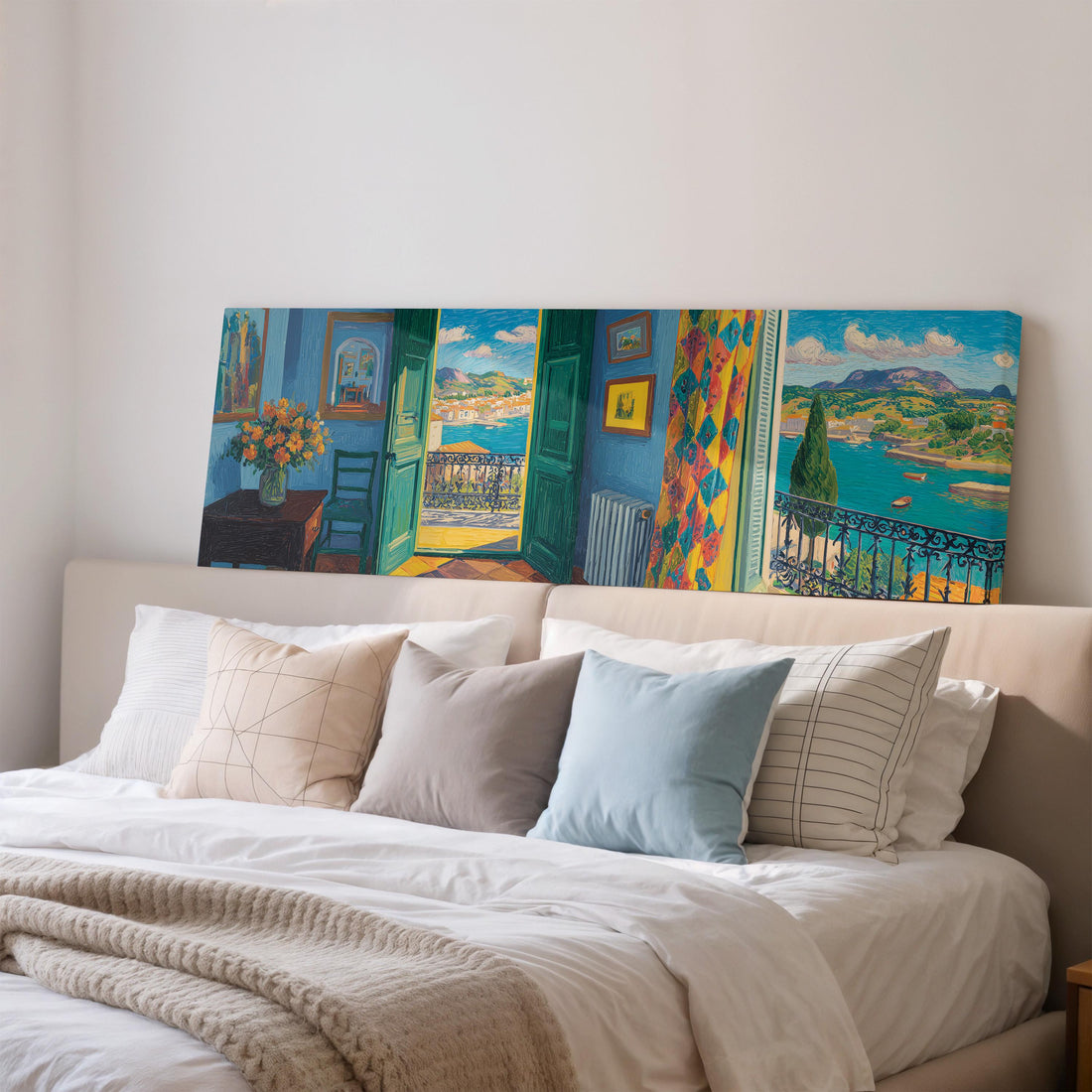 a large, colorful painting of a room with a balcony overlooking a scenic landscape, hanging on a wall above a brown sofa.