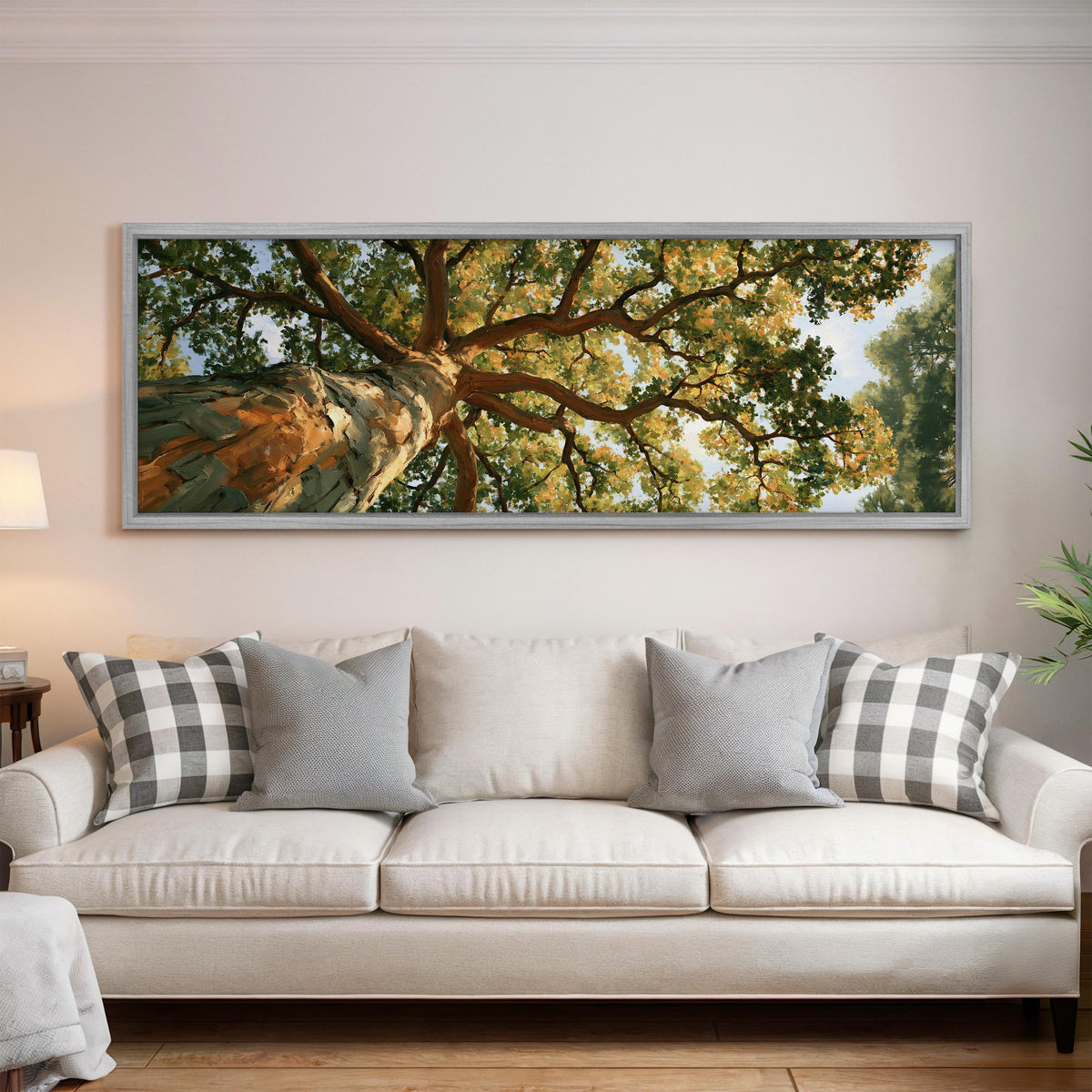 Autumn oak canopy seen from below panoramic canvas print above a white sofa in a bright living room