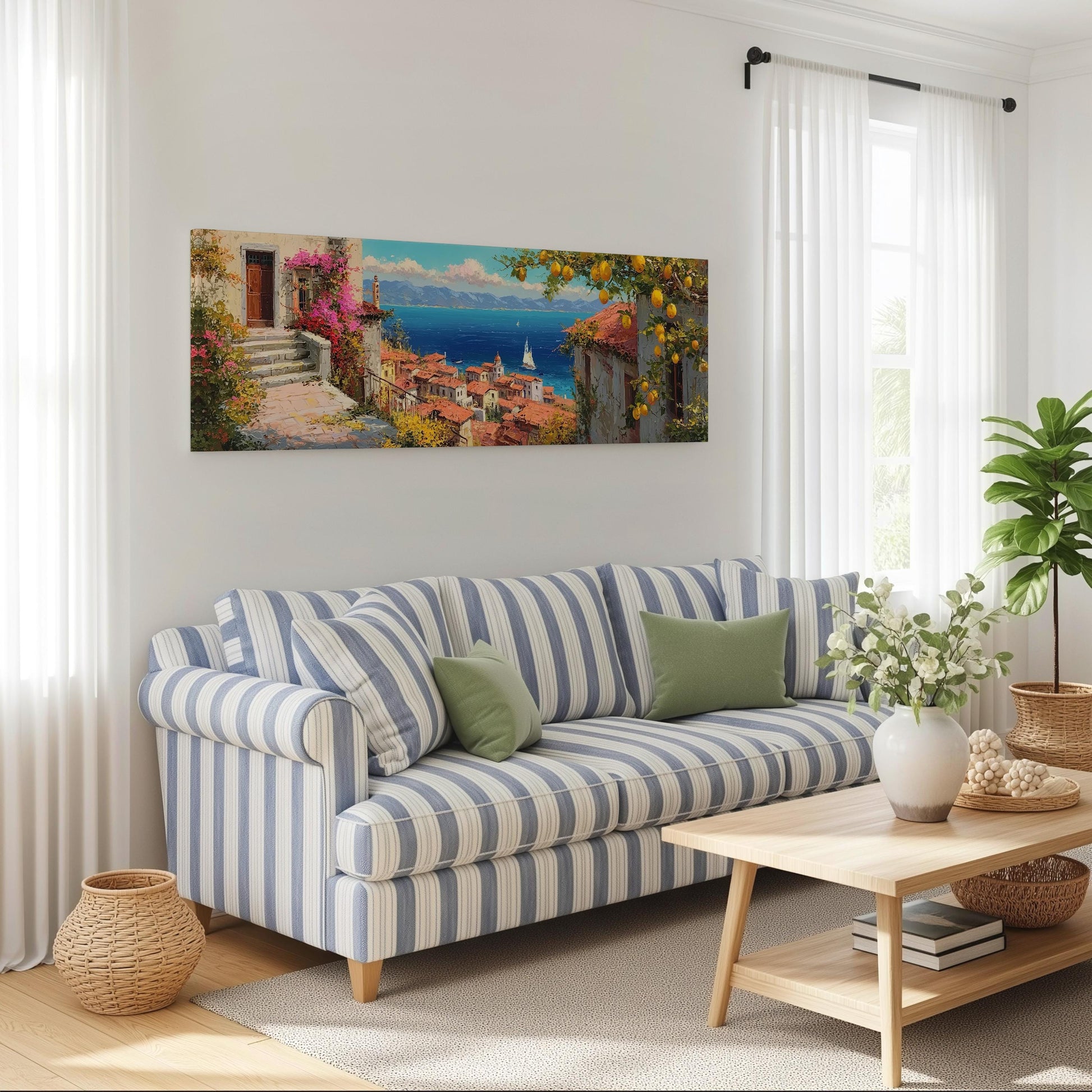 a living room with a striped blue and white sofa, a wooden coffee table, and a large painting of a coastal town hanging on the wall.