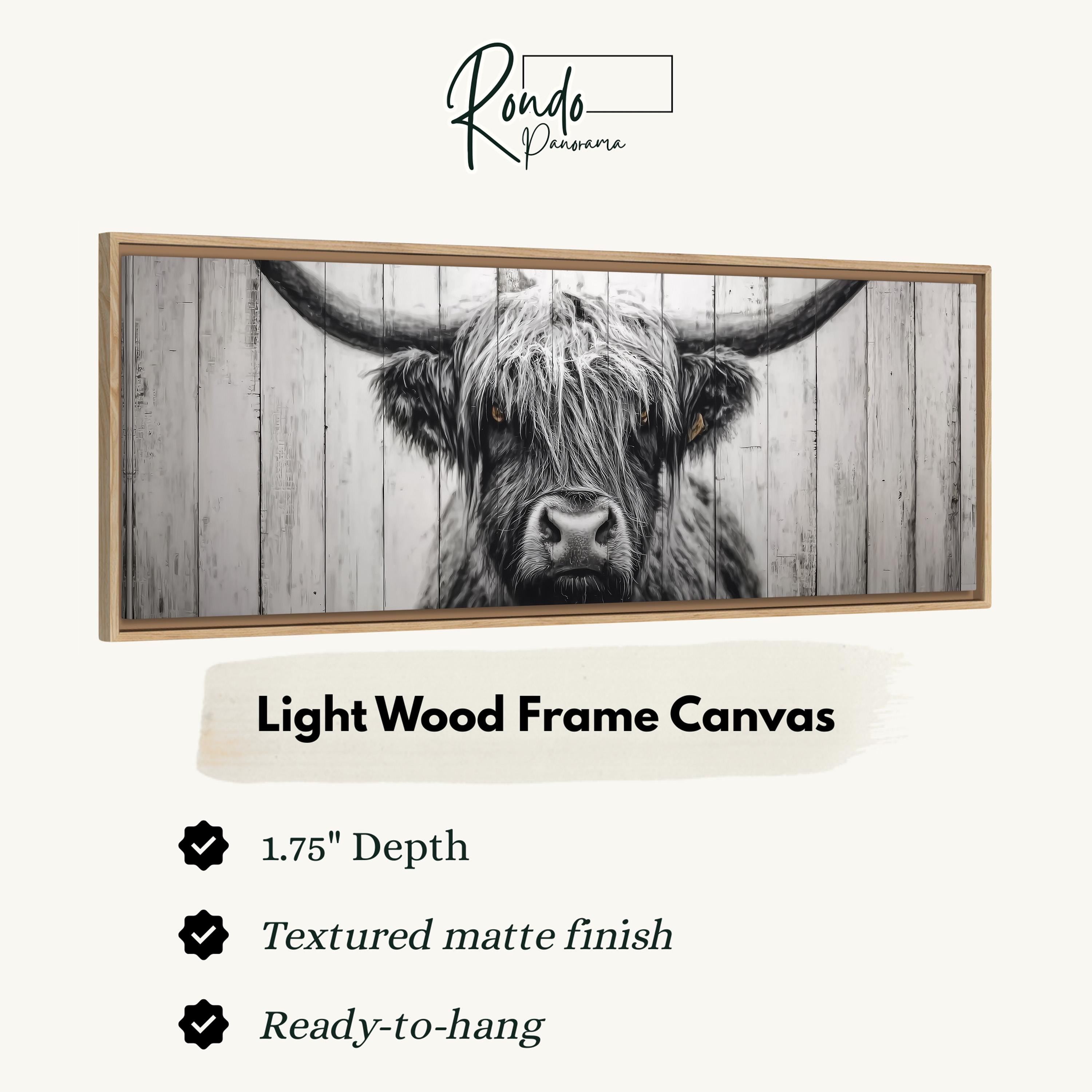 a close-up of a horned animal, possibly a yak or a bull, with a textured matte finish. The frame is made of light wood and has a 1.75" depth. The text indicates that the frame is ready to hang and has a textured matte finish.