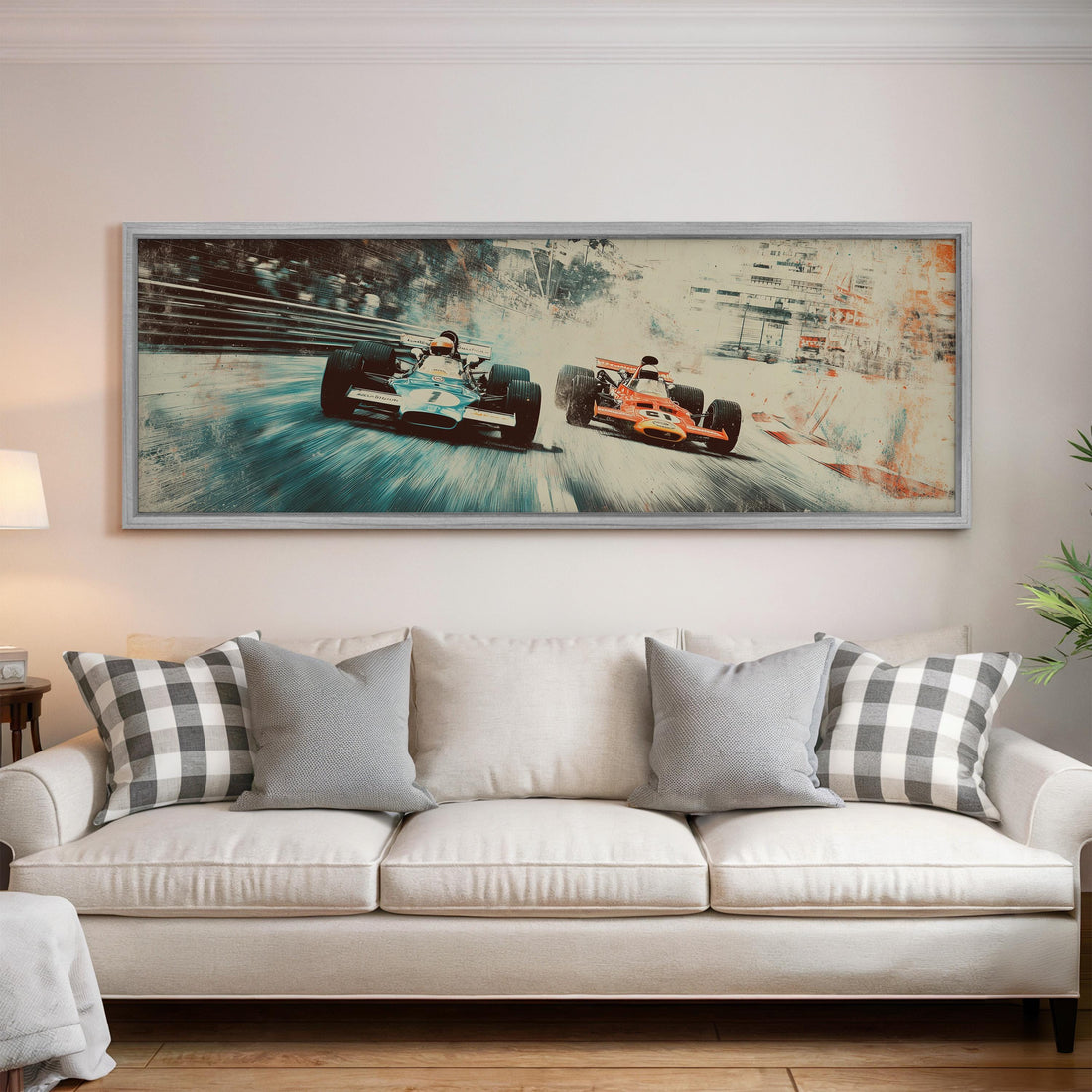 a large framed print of two Formula One race cars speeding down a track, with a checkered sofa in the foreground.