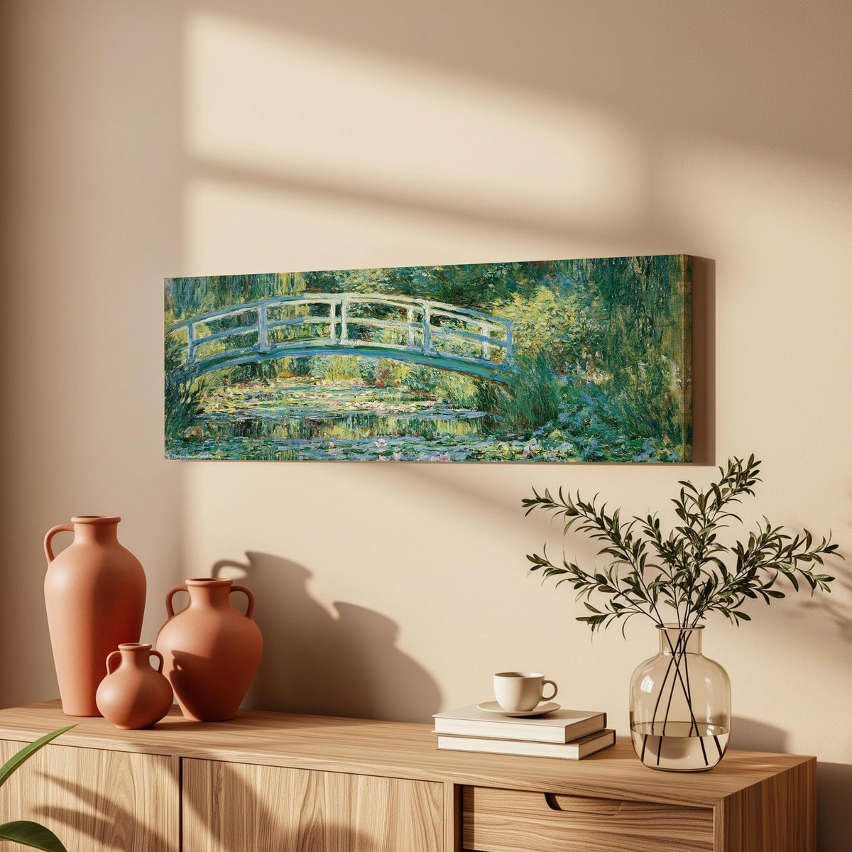 Japanese bridge over a water lily pond long horizontal canvas print above a wooden sideboard