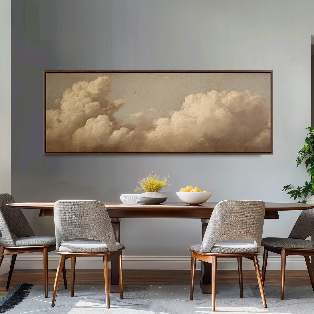 a large, framed painting of a cloudy sky hanging on a wall above a brown sofa with orange cushions.