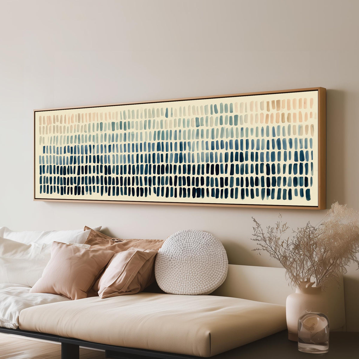 Brushmarks fading from peach to navy long horizontal canvas print above a sofa in a living room
