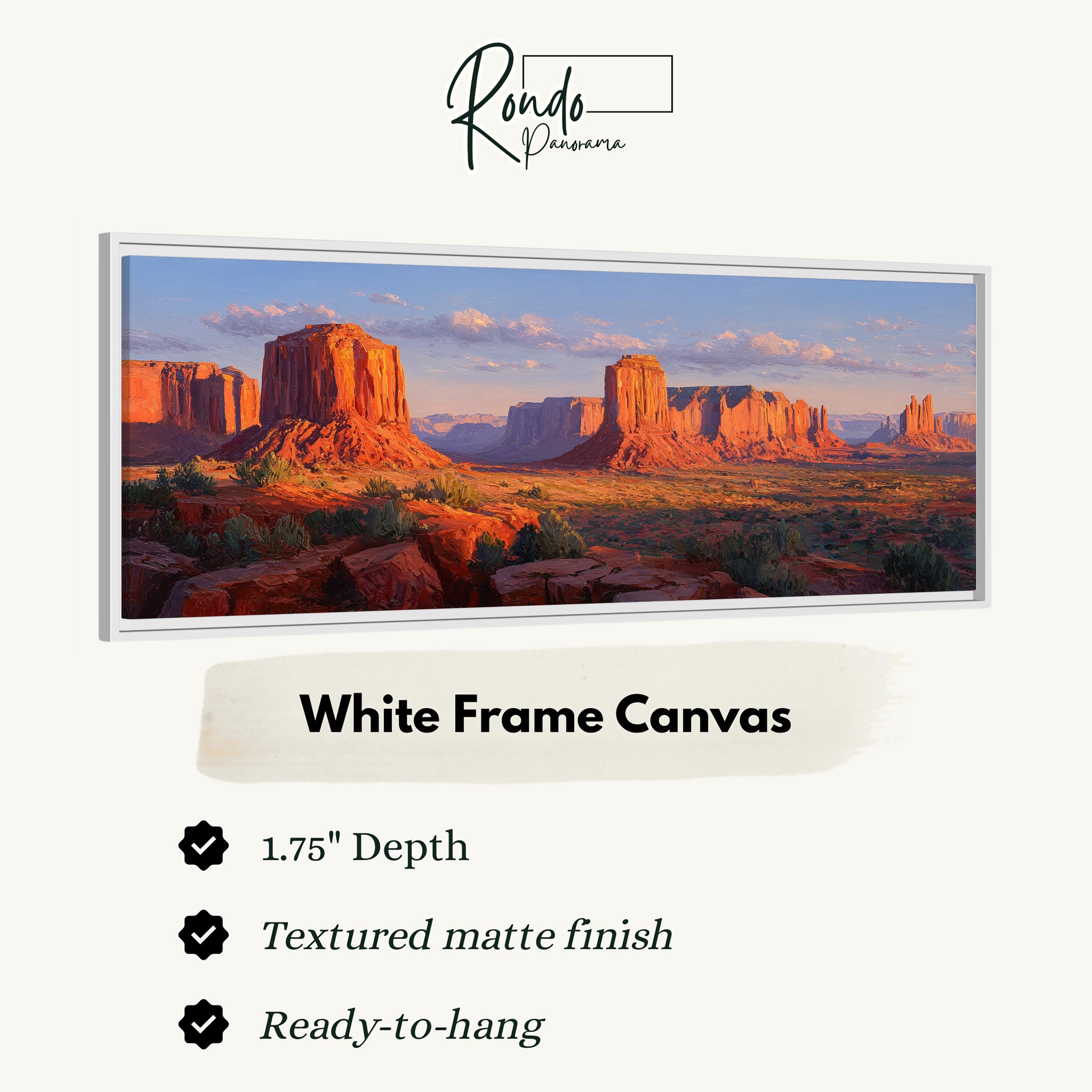 A white frame canvas depicting a scenic desert landscape with red rock formations and a blue sky with clouds.