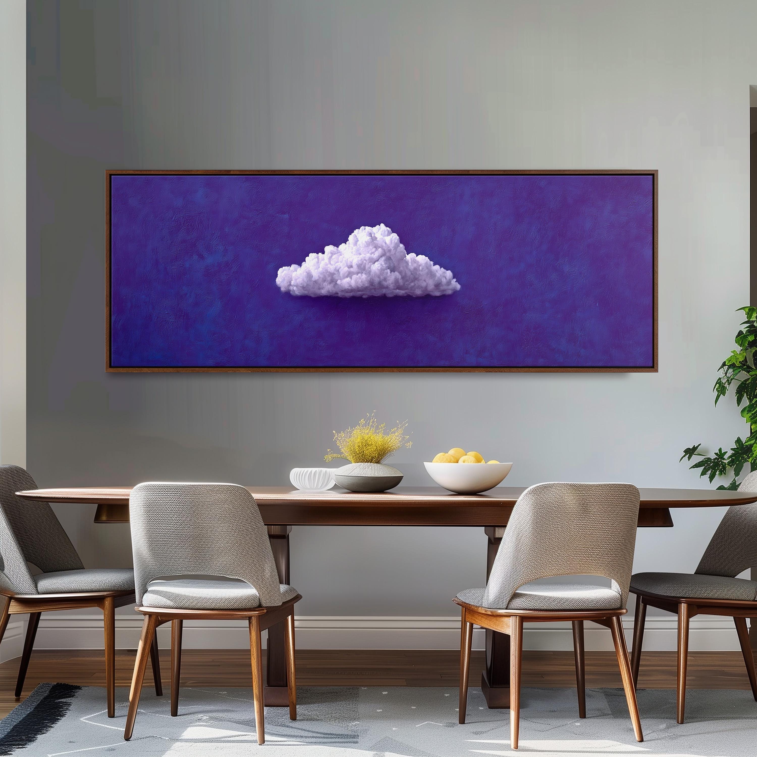 a dining room with a wooden table and four chairs. Above the table, there is a large painting of a cloud on a purple background. The table is set with a bowl of fruit and a vase of flowers.