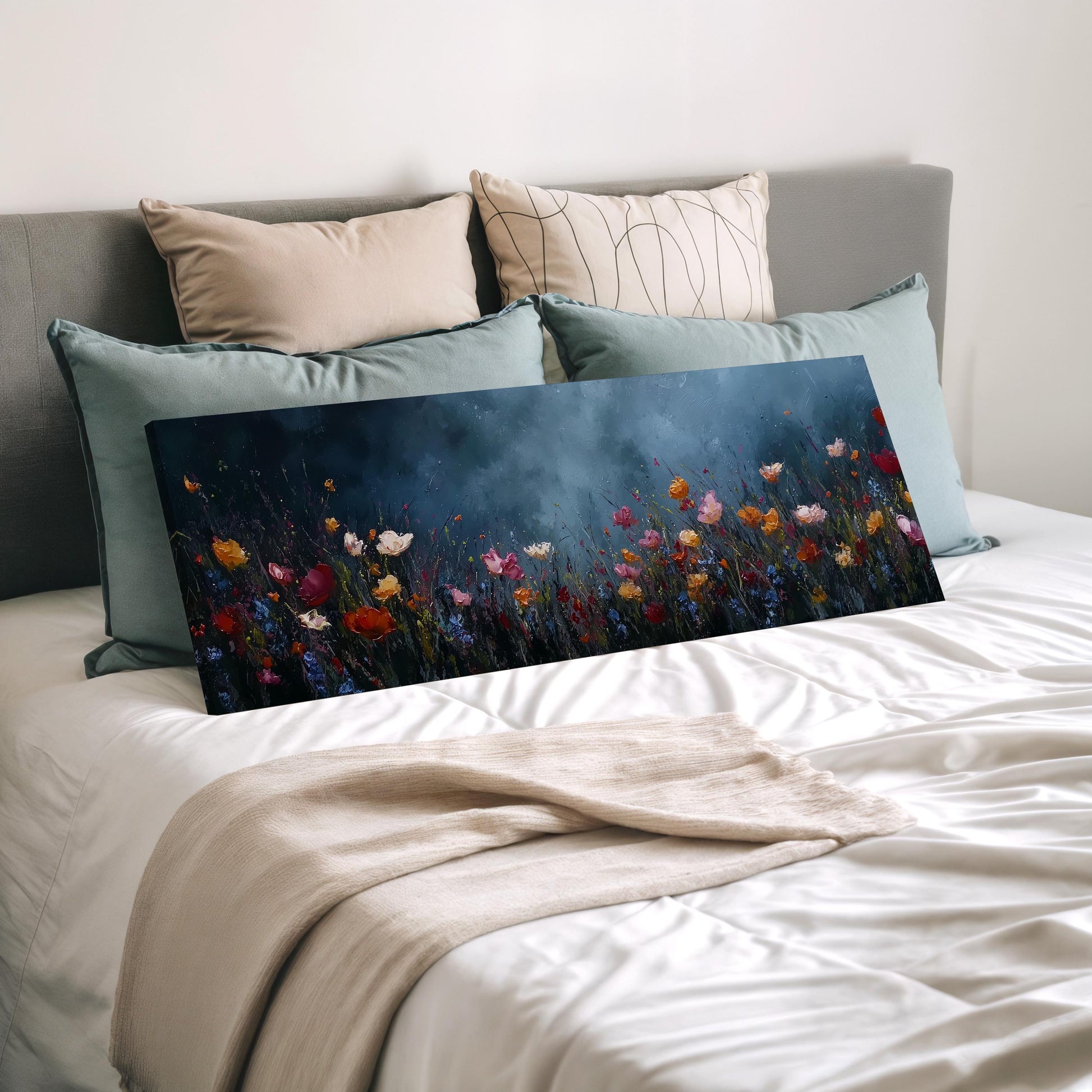 a large canvas print of a colorful floral scene, displayed on a bed with a white comforter and pillows.