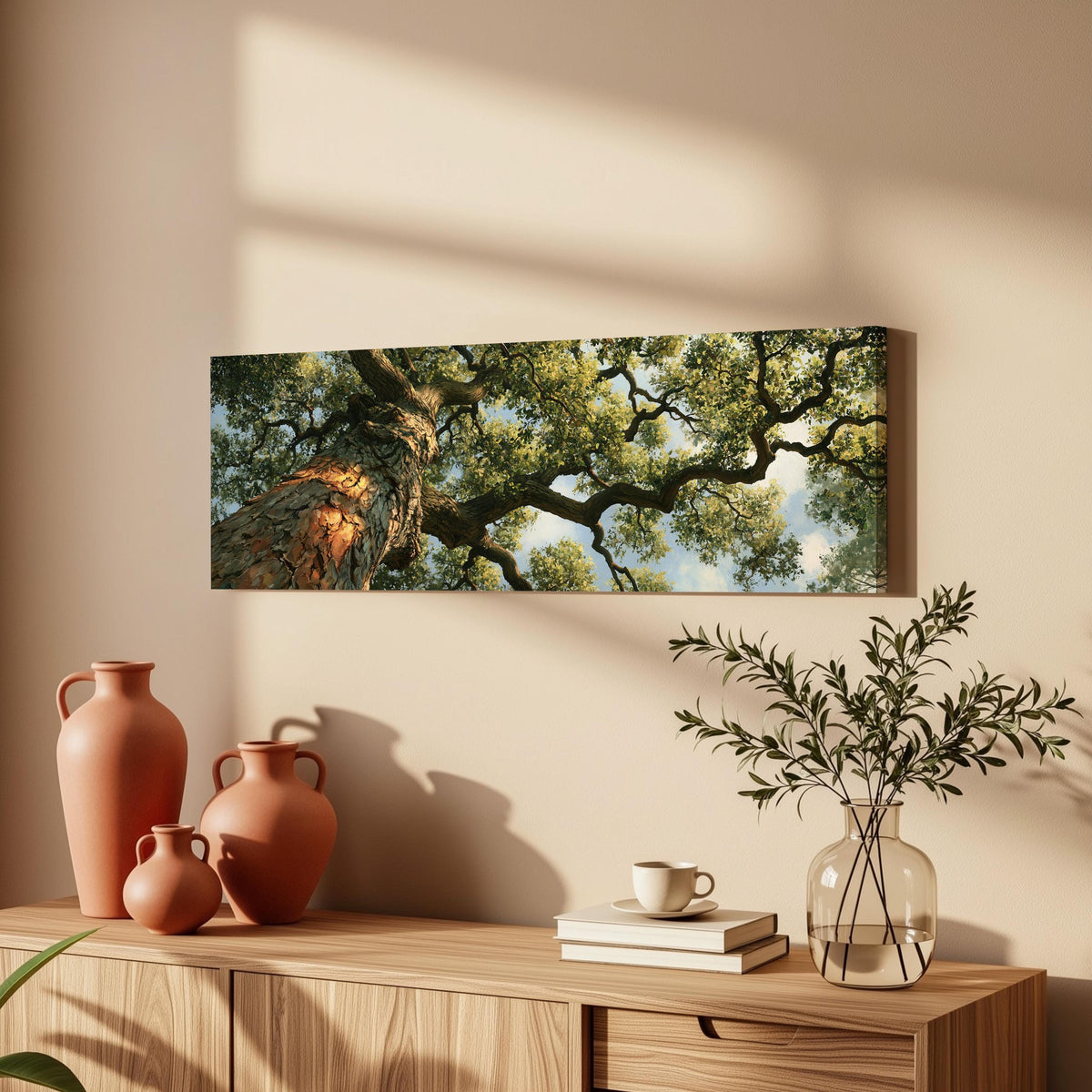 Ancient oak trunk and branches seen from below long horizontal canvas print above a wooden sideboard