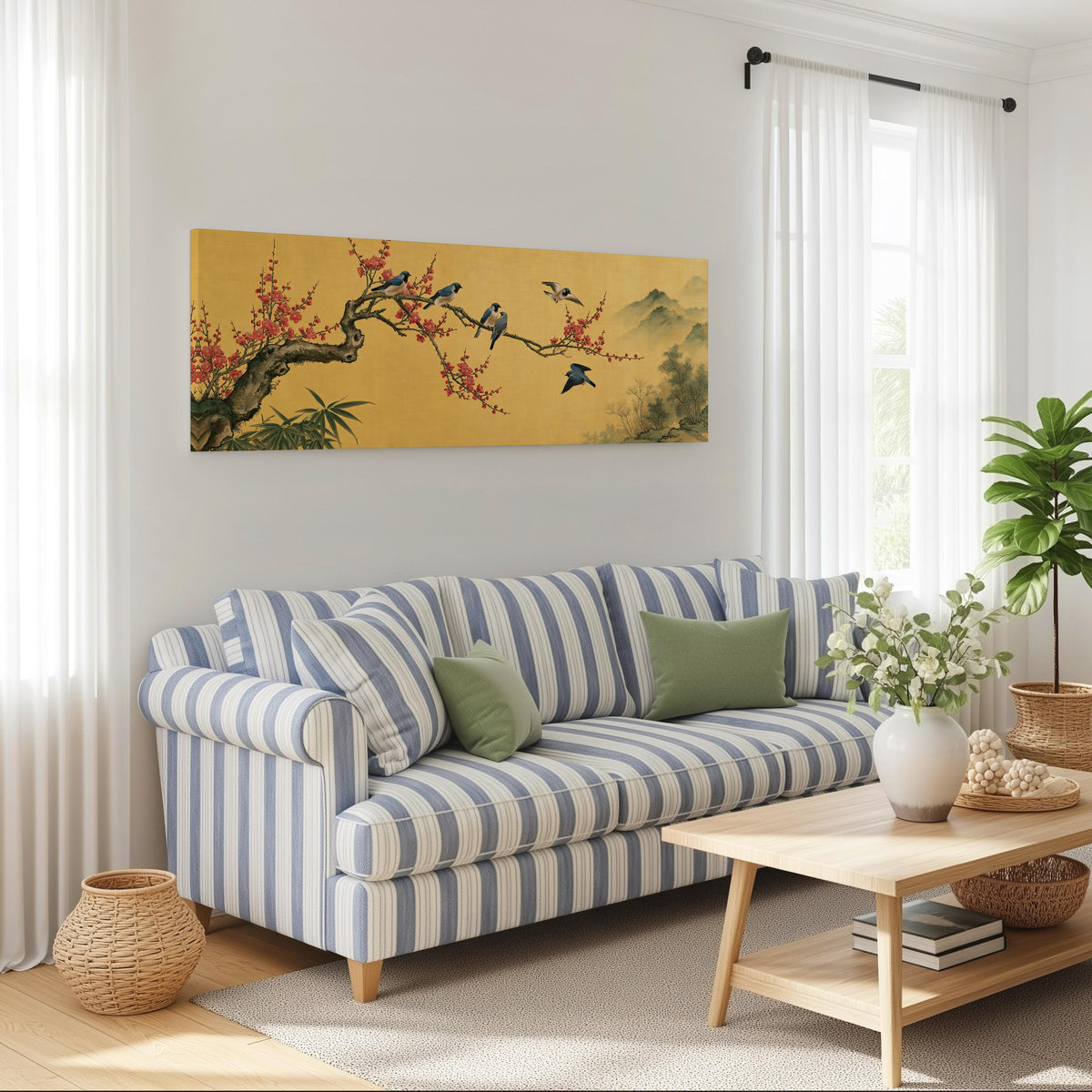 Birds on a plum blossom branch on gold long horizontal canvas print above a striped sofa in a coastal living room