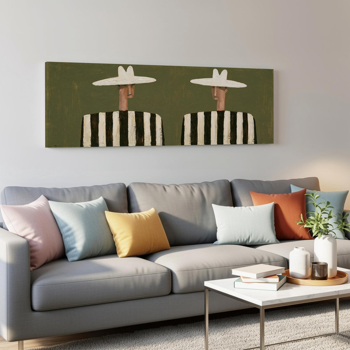 Two figures in striped shirts panoramic canvas print above a grey sofa in a living room