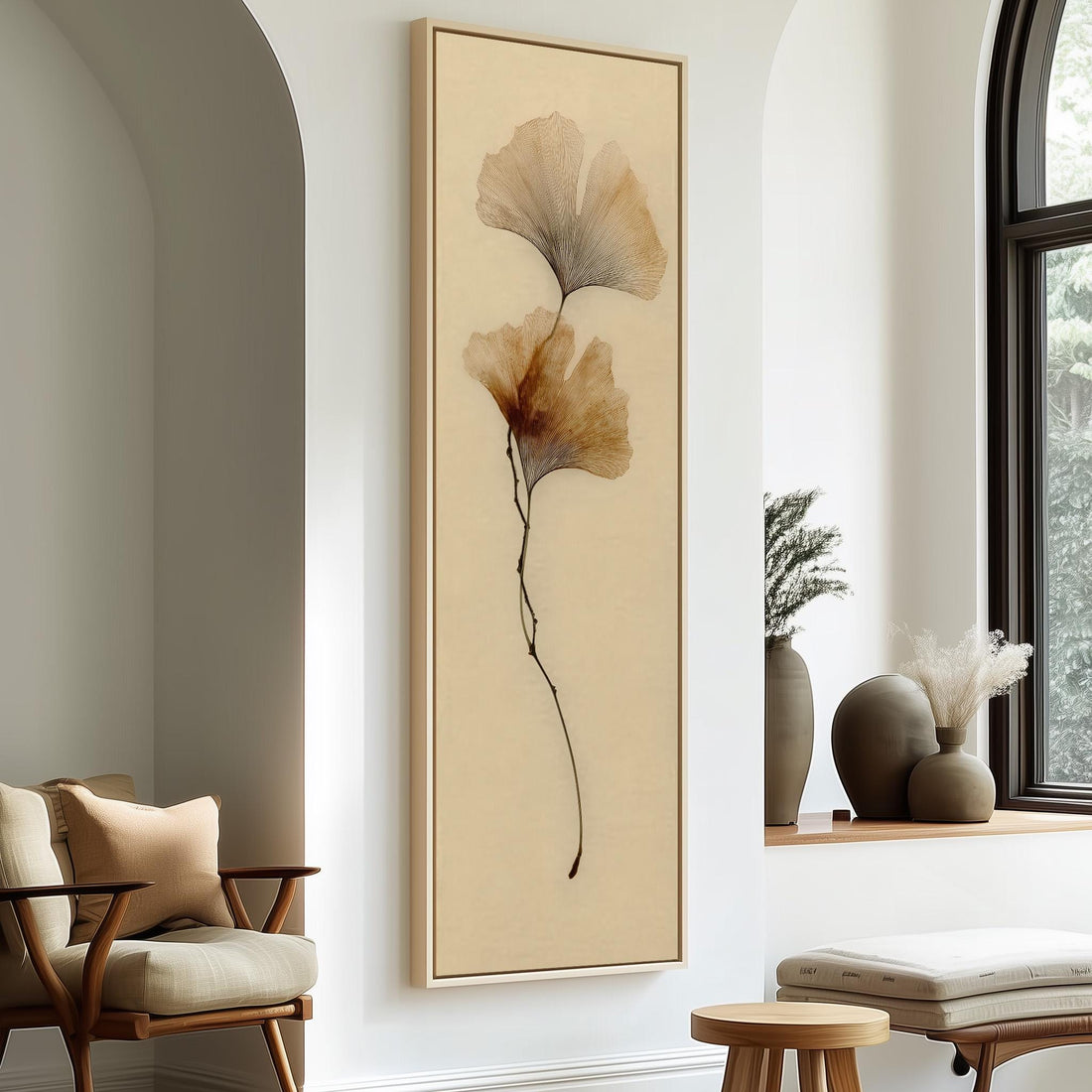 a minimalist living room with a large framed artwork of a plant on the wall, a wooden chair, a small table, and a window with a plant on the sill.