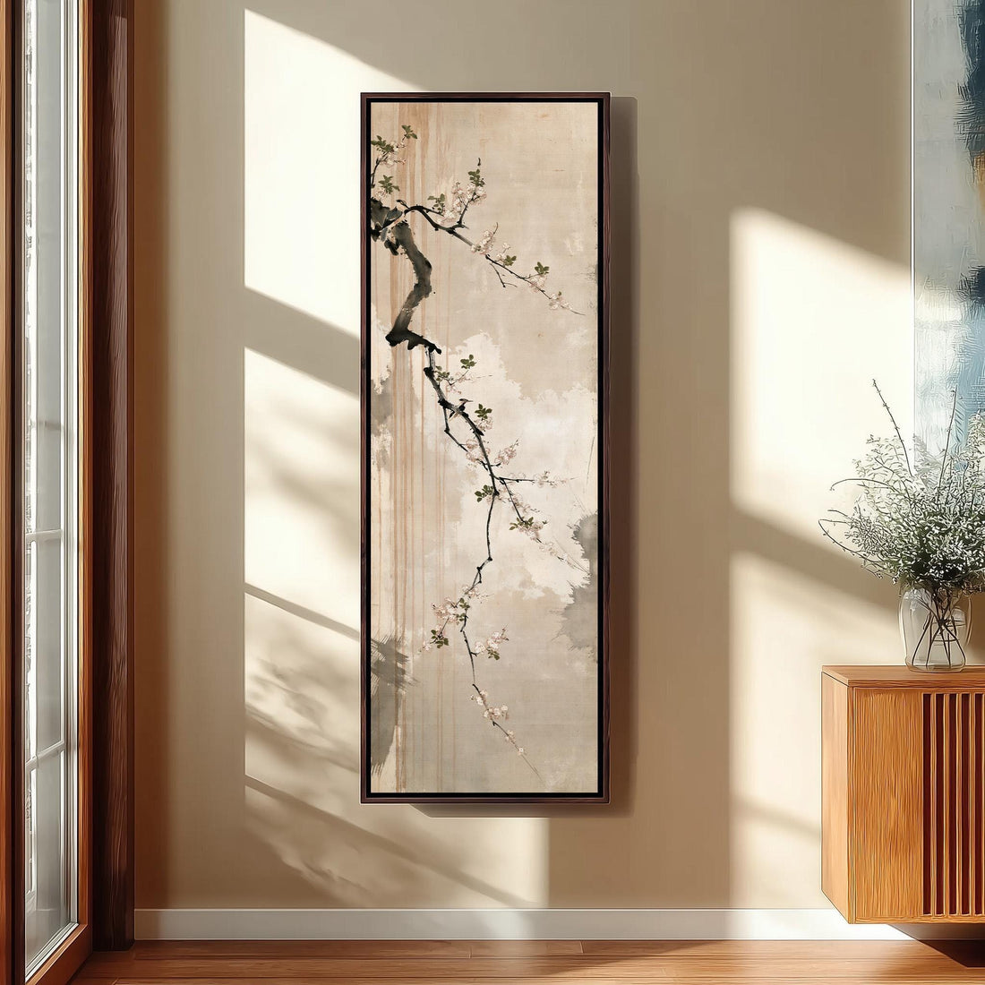 Small birds on a cherry blossom branch long vertical canvas print in a sunlit living space