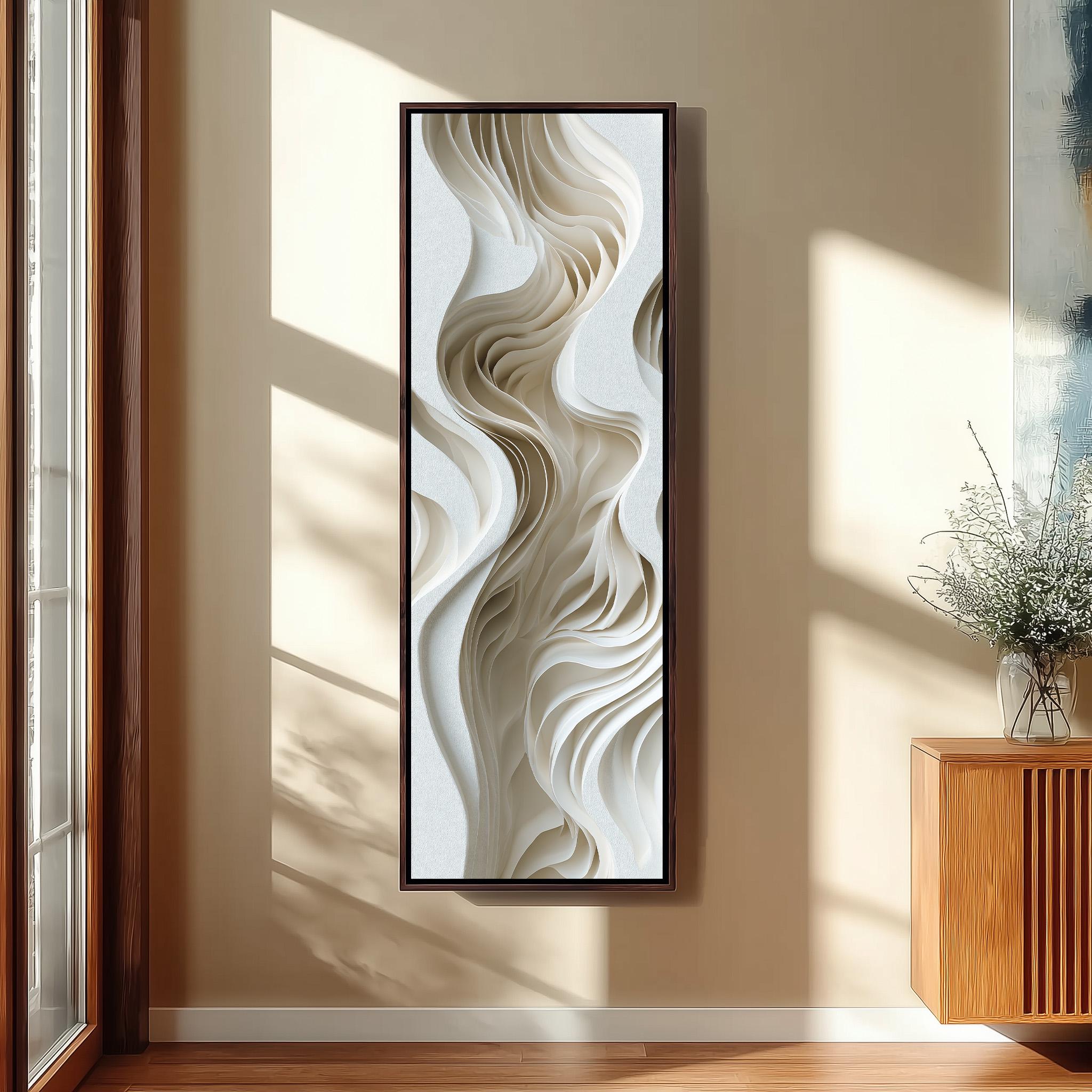 a large abstract artwork hanging on a wall, with a wooden cabinet and a vase of flowers to the right of the artwork.