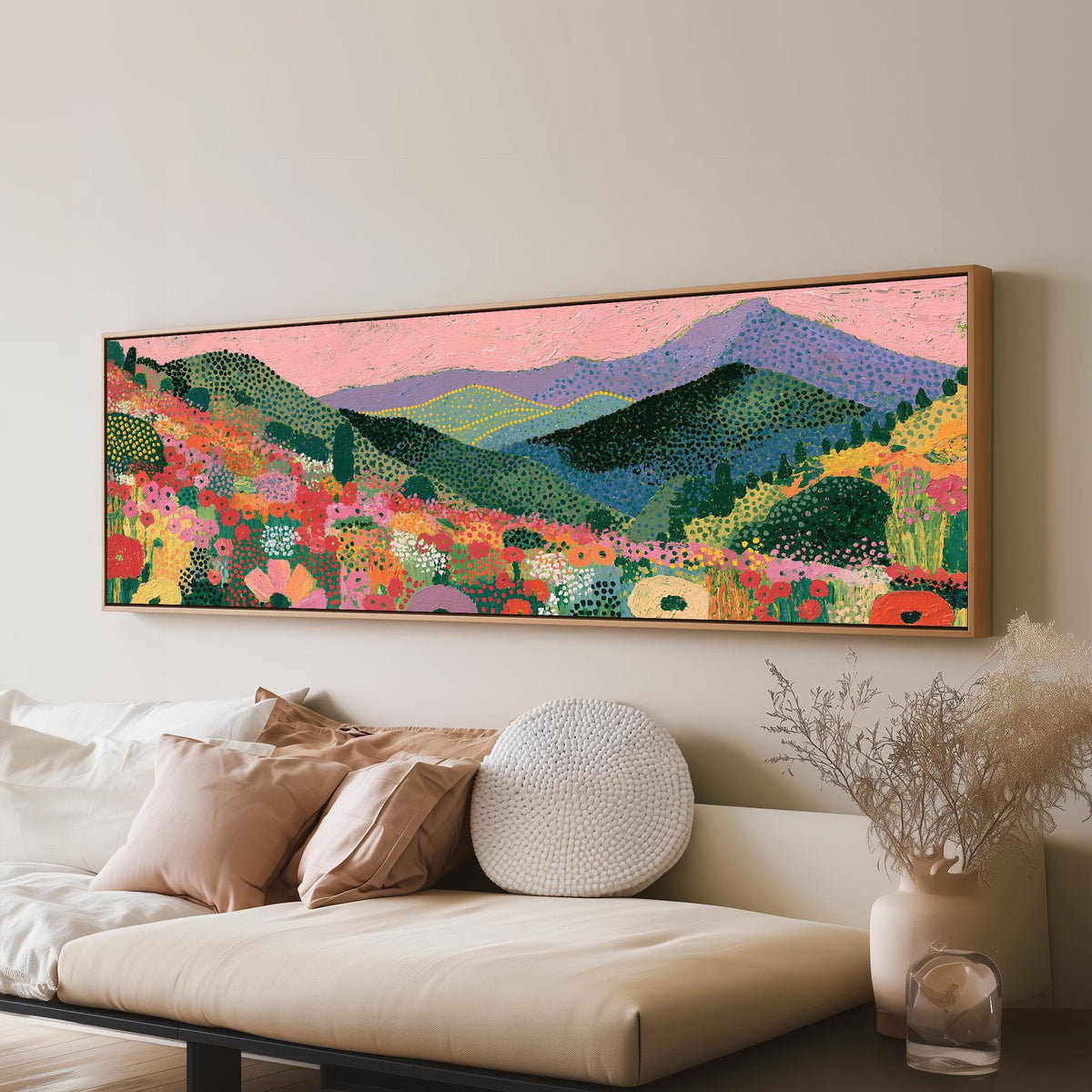 Purple mountains over a flower meadow panoramic canvas print above a sofa in a living room