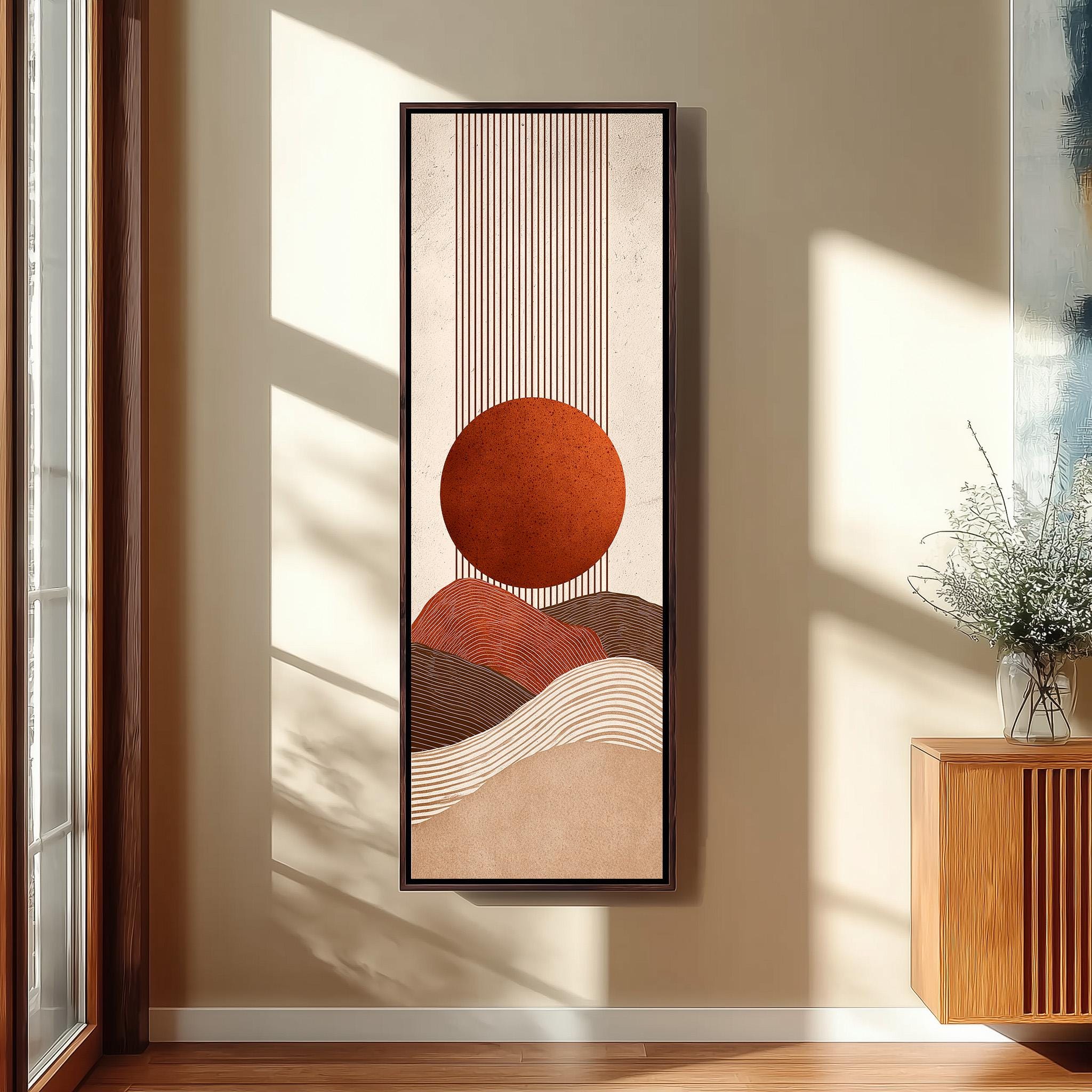 a large abstract painting hanging on a wall, depicting a sun-like shape with a circular design in shades of orange and brown.