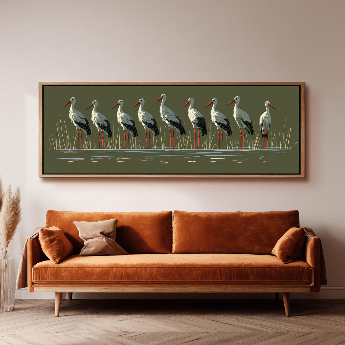 Flock of storks on olive green panoramic canvas print above a sofa in a living room