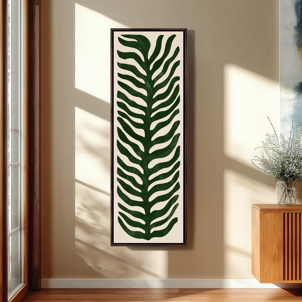 Stylized dark green fern leaf tall skinny canvas print in a sunlit living space