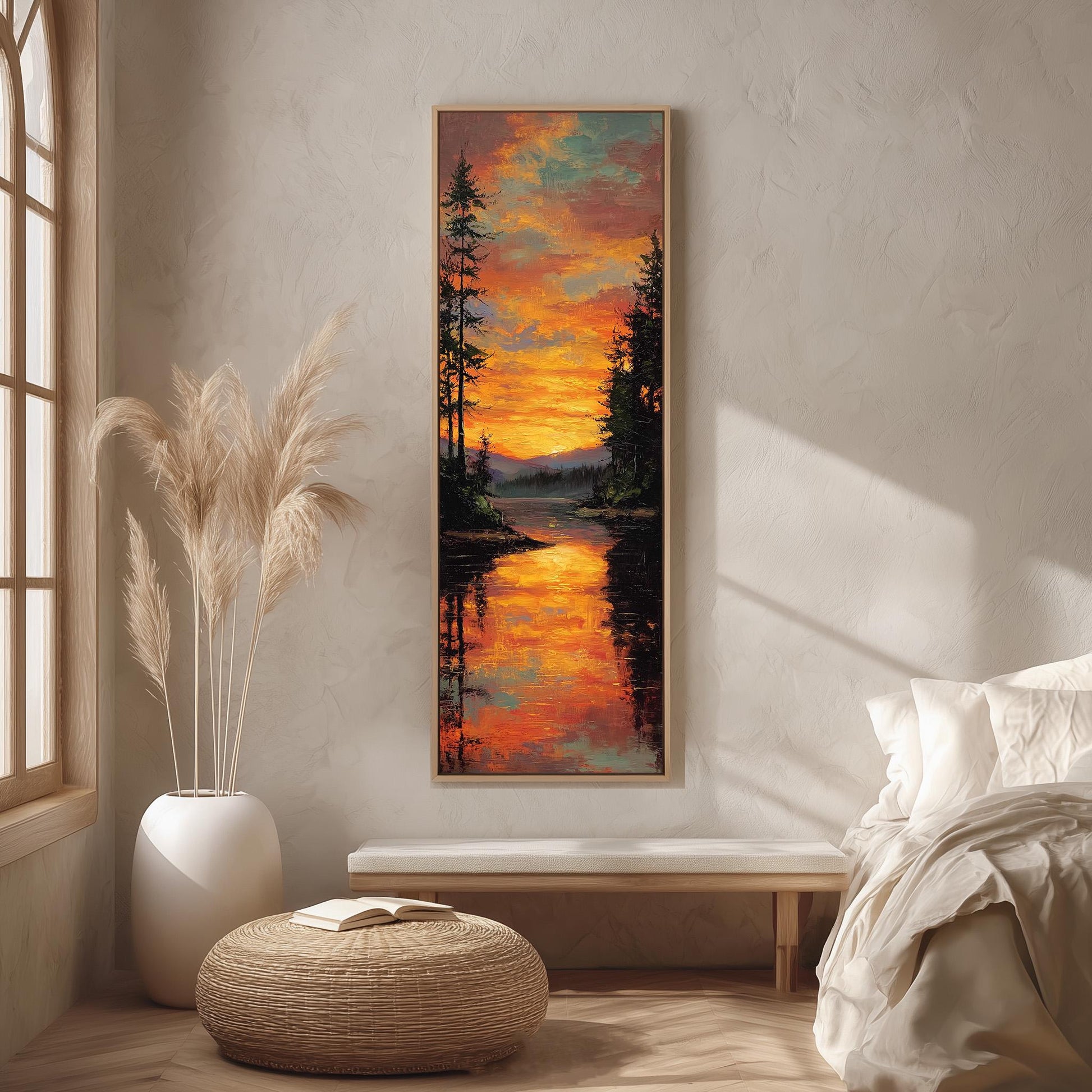 a serene bedroom scene with a large painting of a sunset landscape hanging on the wall. The painting depicts a tranquil lake surrounded by trees, with the sky filled with vibrant orange and yellow hues. The room is decorated with a white bed, a wicker ottoman, and a potted plant, creating a cozy and inviting atmosphere.
