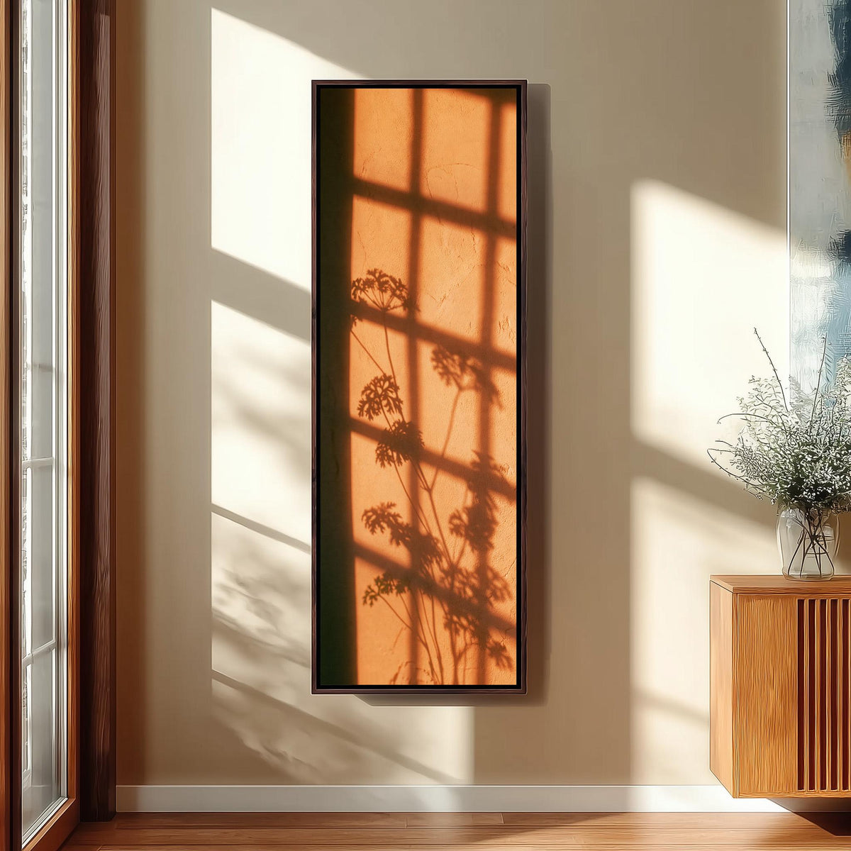 Window grid and plant shadow on a terracotta wall long vertical canvas print in a sunlit living space