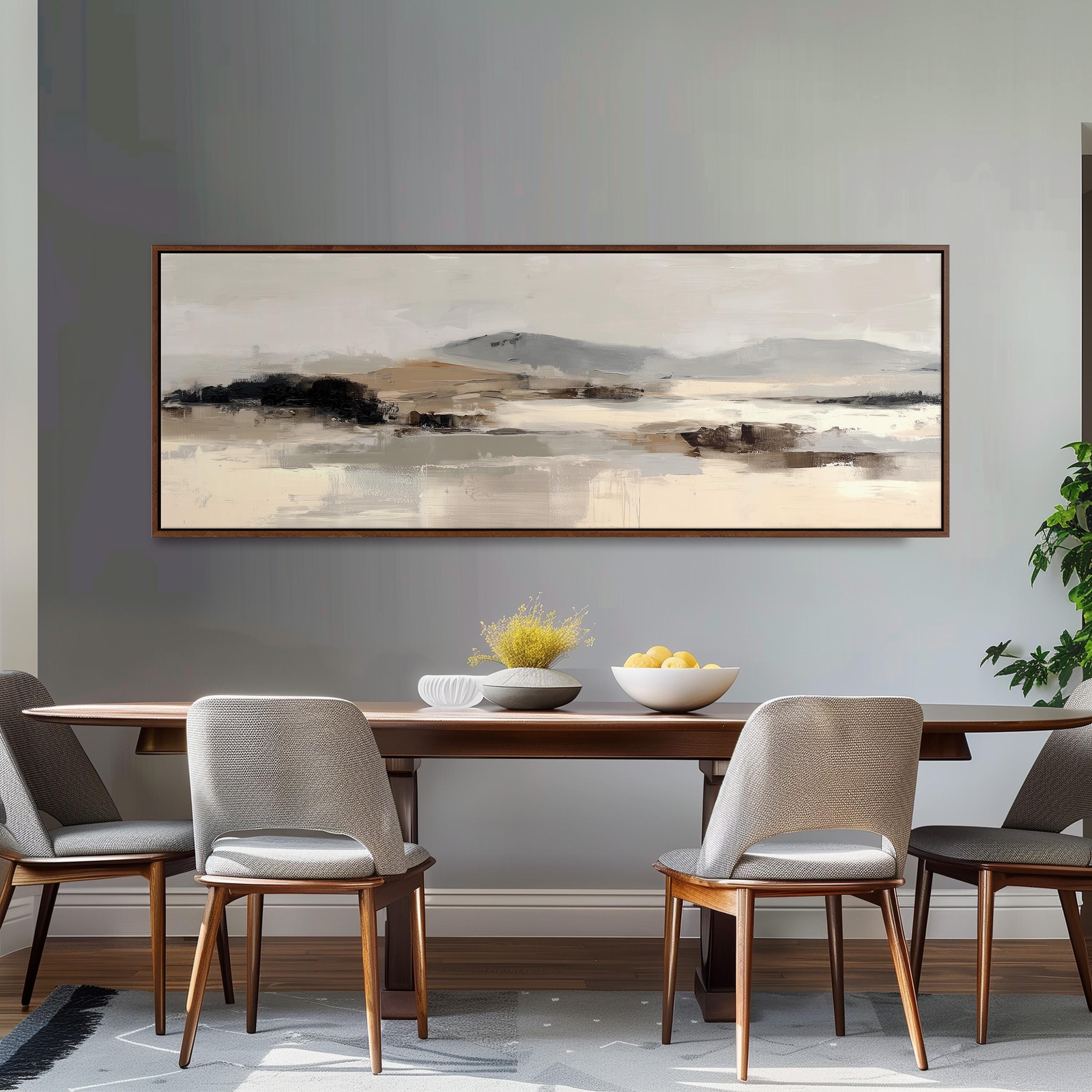 a dining room with a large painting of a landscape hanging on the wall above a wooden dining table with four chairs. The table is set with a bowl of fruit and a vase of flowers, creating a cozy and inviting atmosphere.