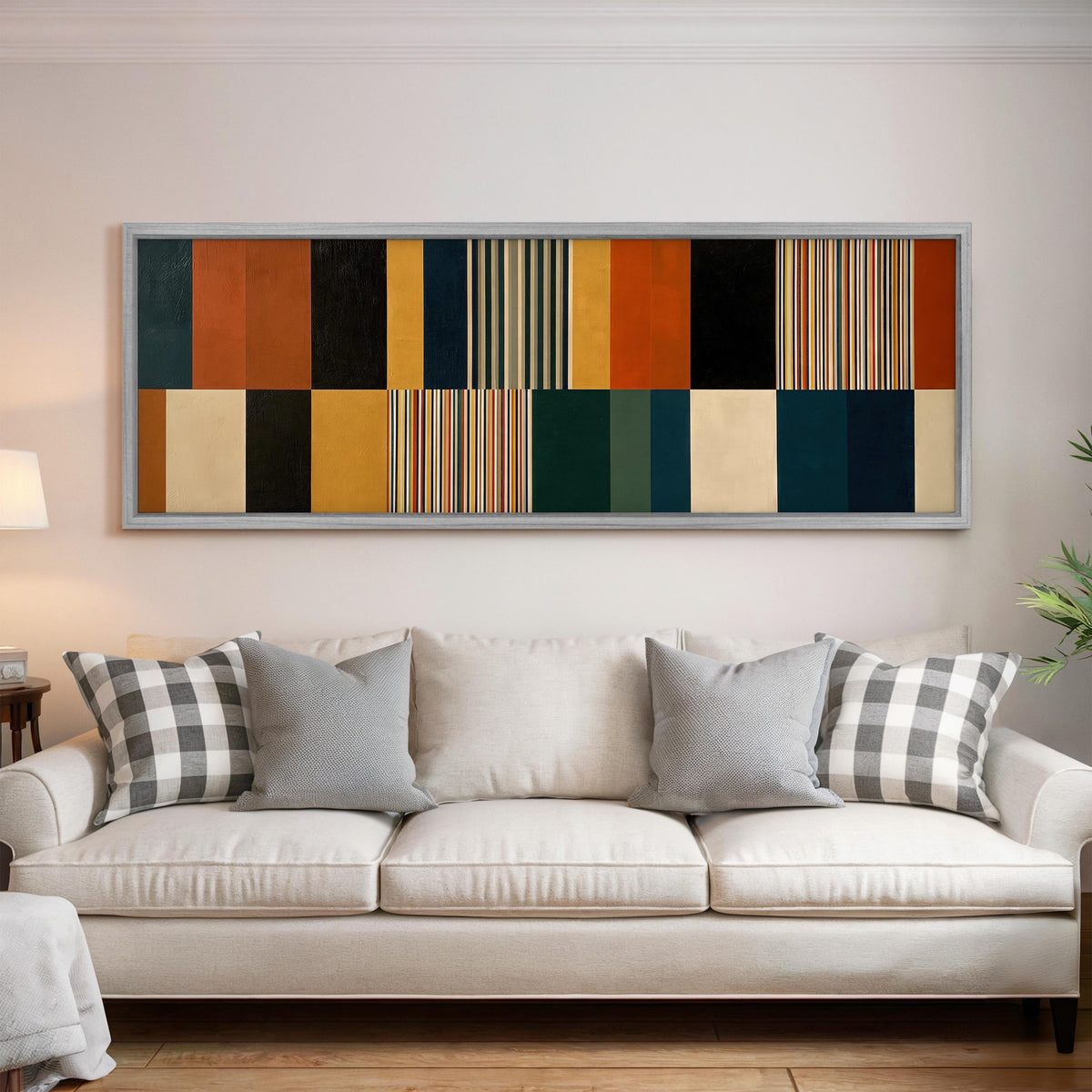 Autumn and teal stripe color blocks panoramic canvas print above a white sofa in a bright living room