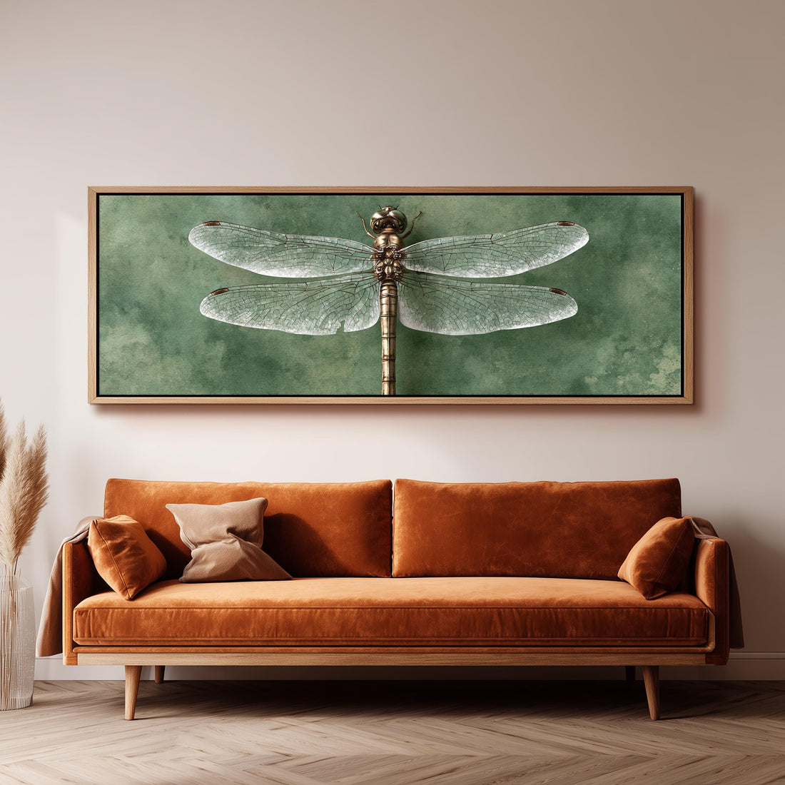 Dragonfly illustration on sage long horizontal canvas print above a sofa in a living room