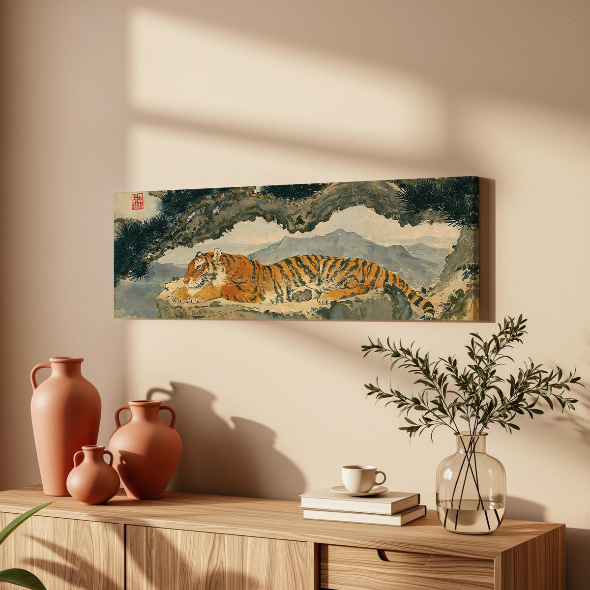 Tiger resting beneath misty pines long horizontal canvas print above a wooden sideboard